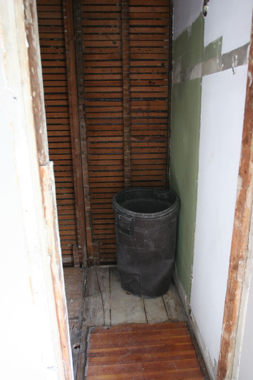 That trash can gives you an idea of just how tiny that shower was.