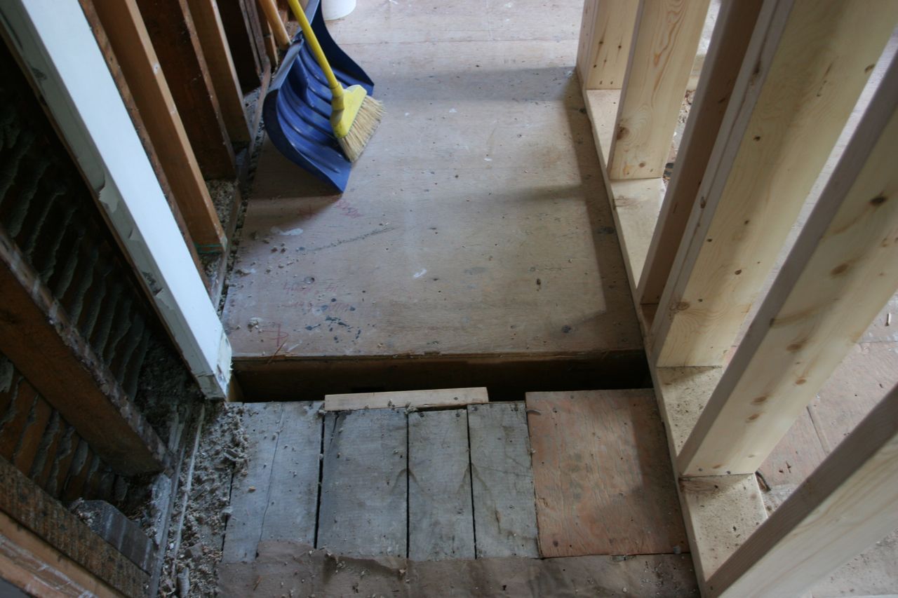 Somewhere along here will be a threshold and a doorway to our downstairs powder room.