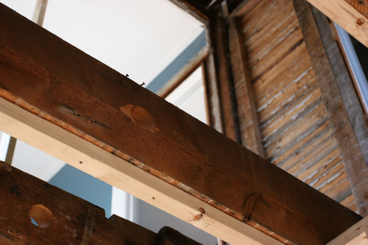 Some of the strapping (to make the ceiling level-ish and a tad lower) on the joists beneath the naked future master bath.