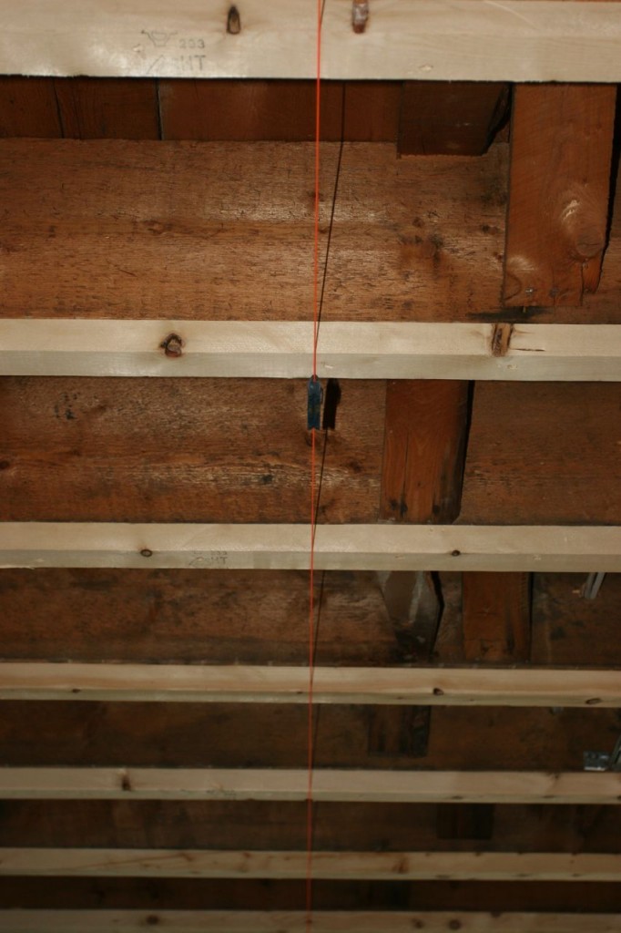 The little orange string is telling the builders just how un-level our ceiling is. And the kitchen in general.