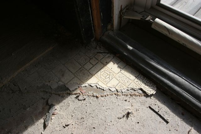Some lingering bits of flooring by the kitchen door.