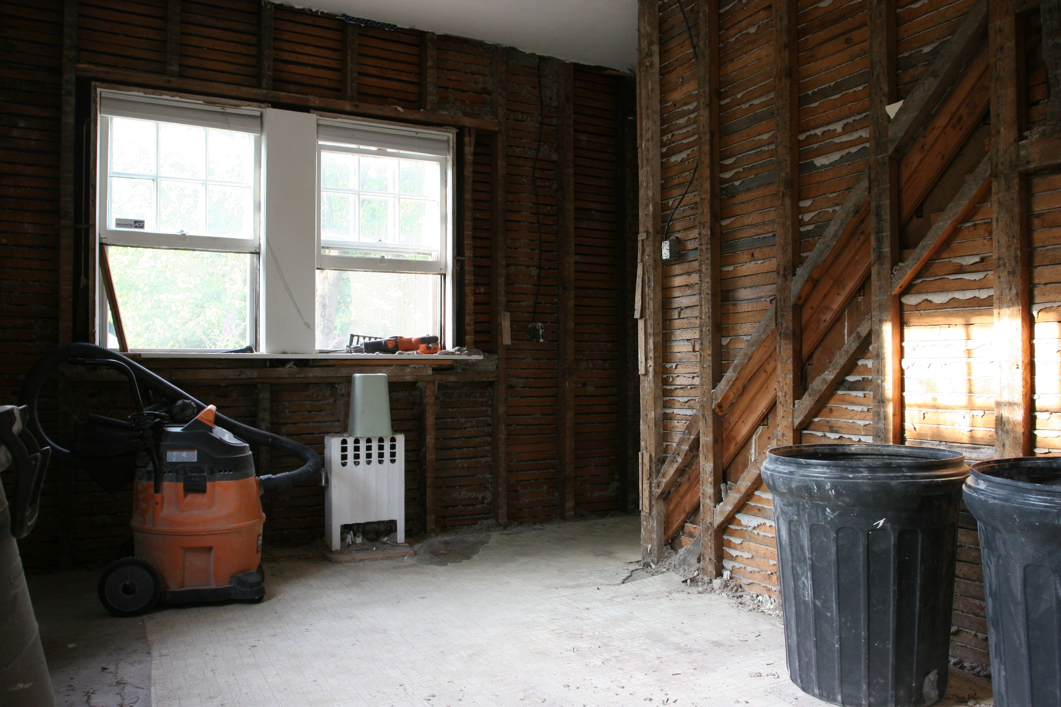 Front of kitchen, future home of a breakfast bar, and pantry at foot of maid's staircase.