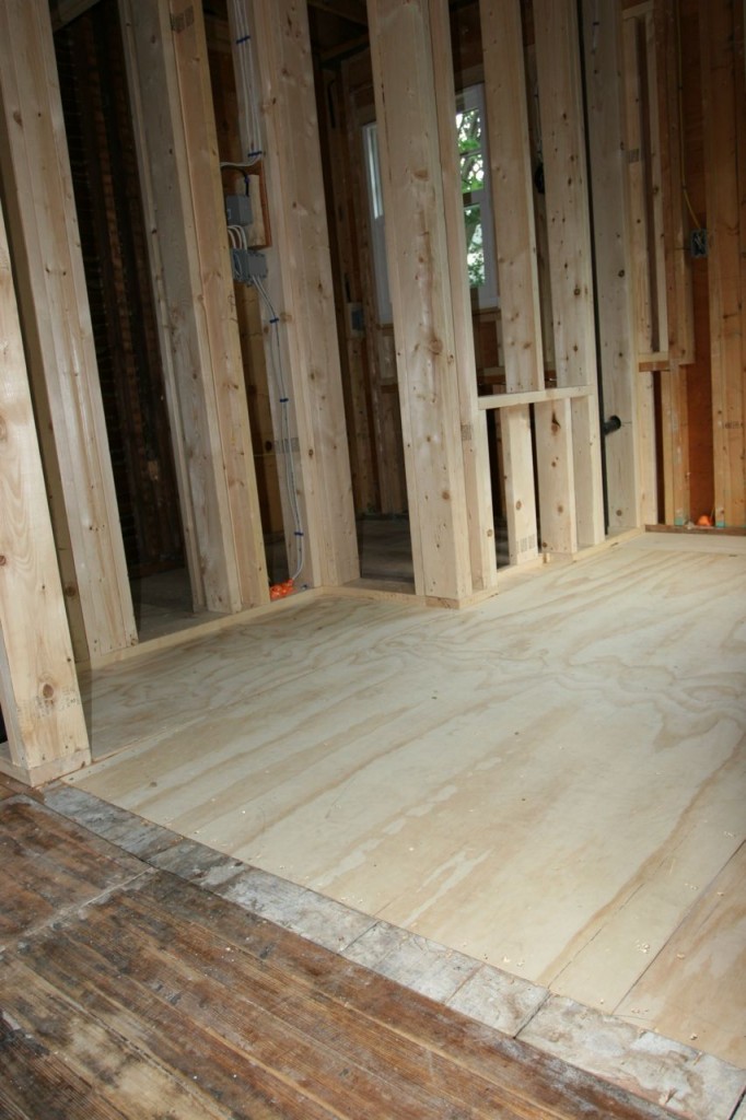 New luan over the subfloor to bring the un-level floors closer together.