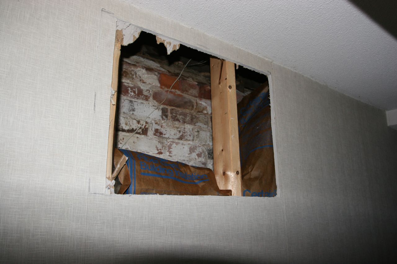 An access hole for the basement rewiring. We have wallpaper we can patch those spots with when the time comes.