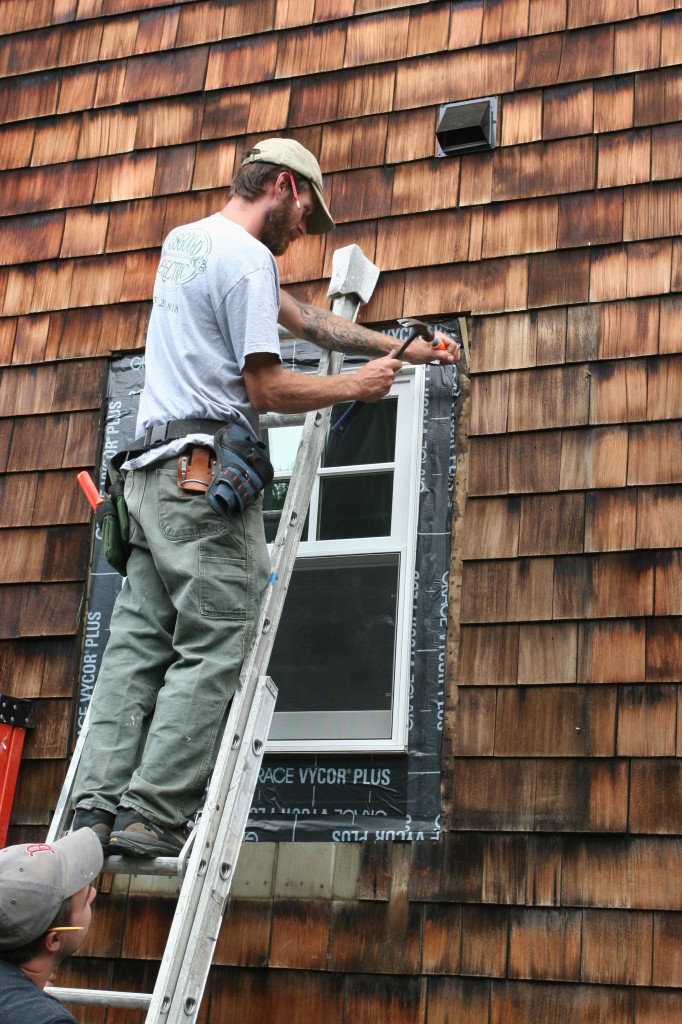 Hand work, chiseling out the brittle shingles.