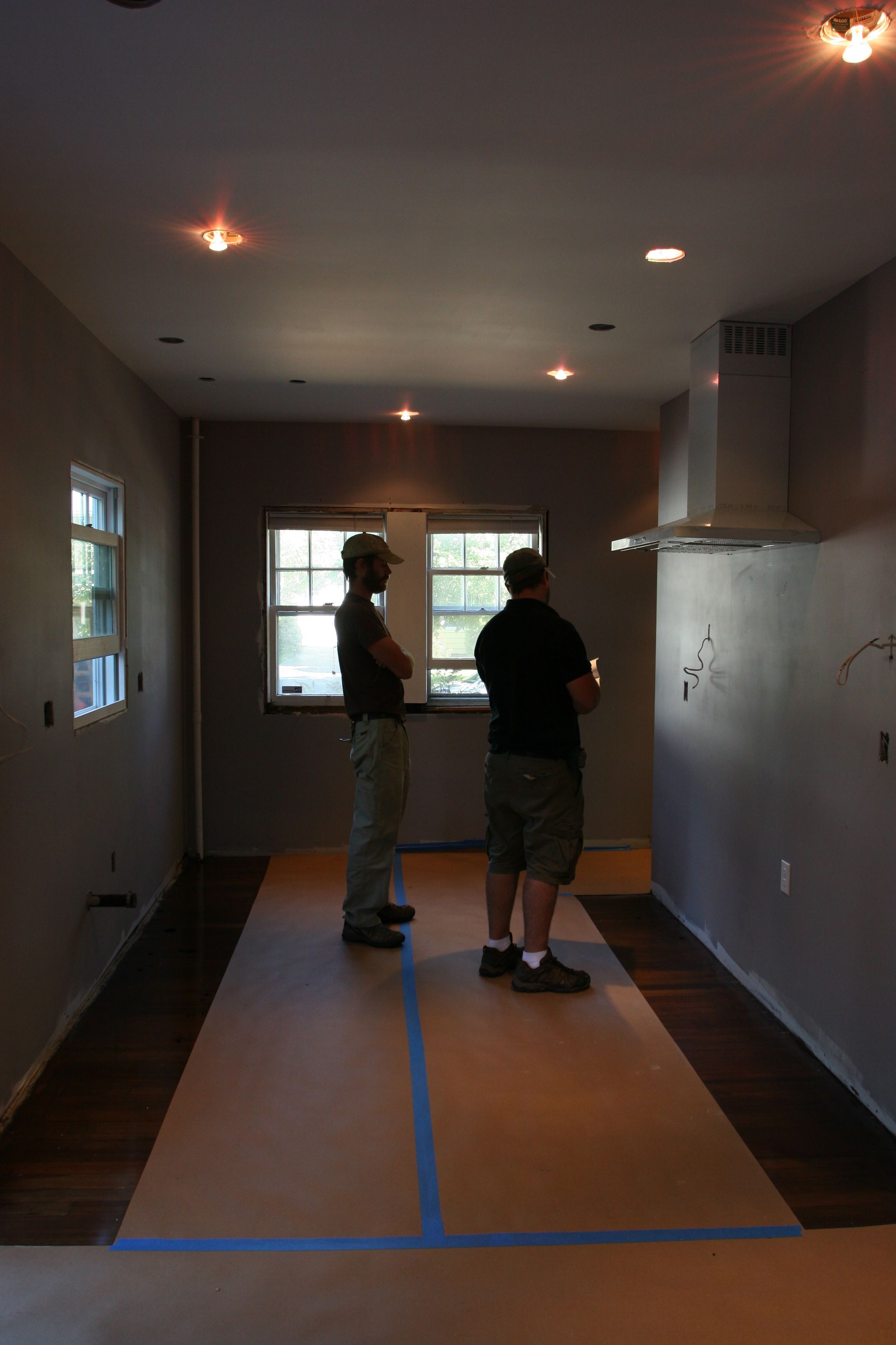Eric and Dave attacking the layout for the cabinets.