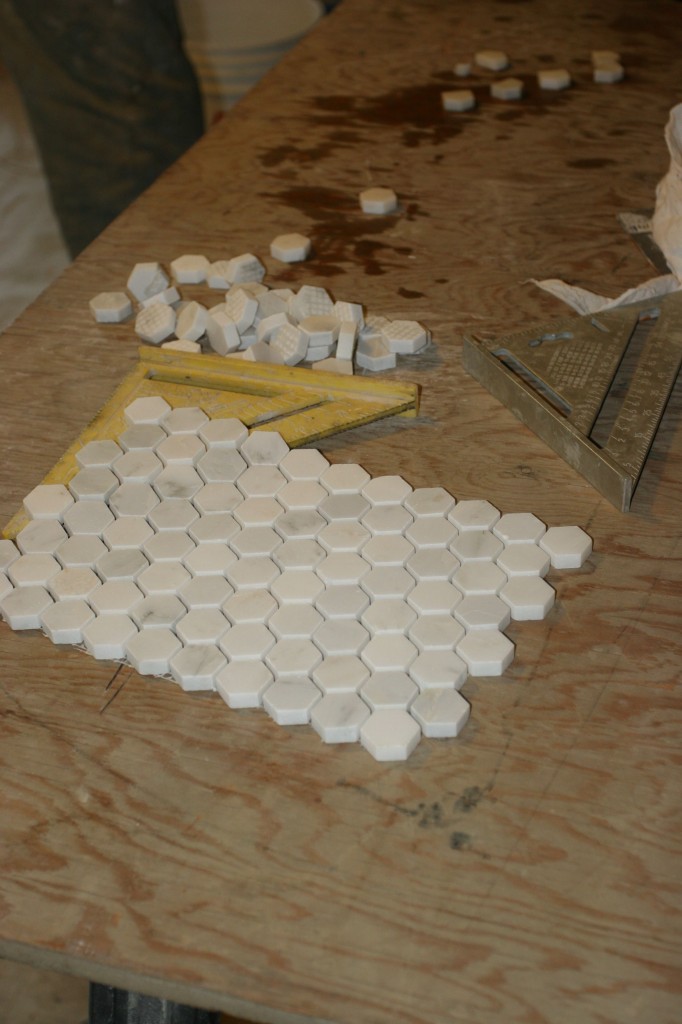 Preparing for the install, Caleb pre-cut the hex tiles to the exact dimensions he needed to fill in along the edges of the border.