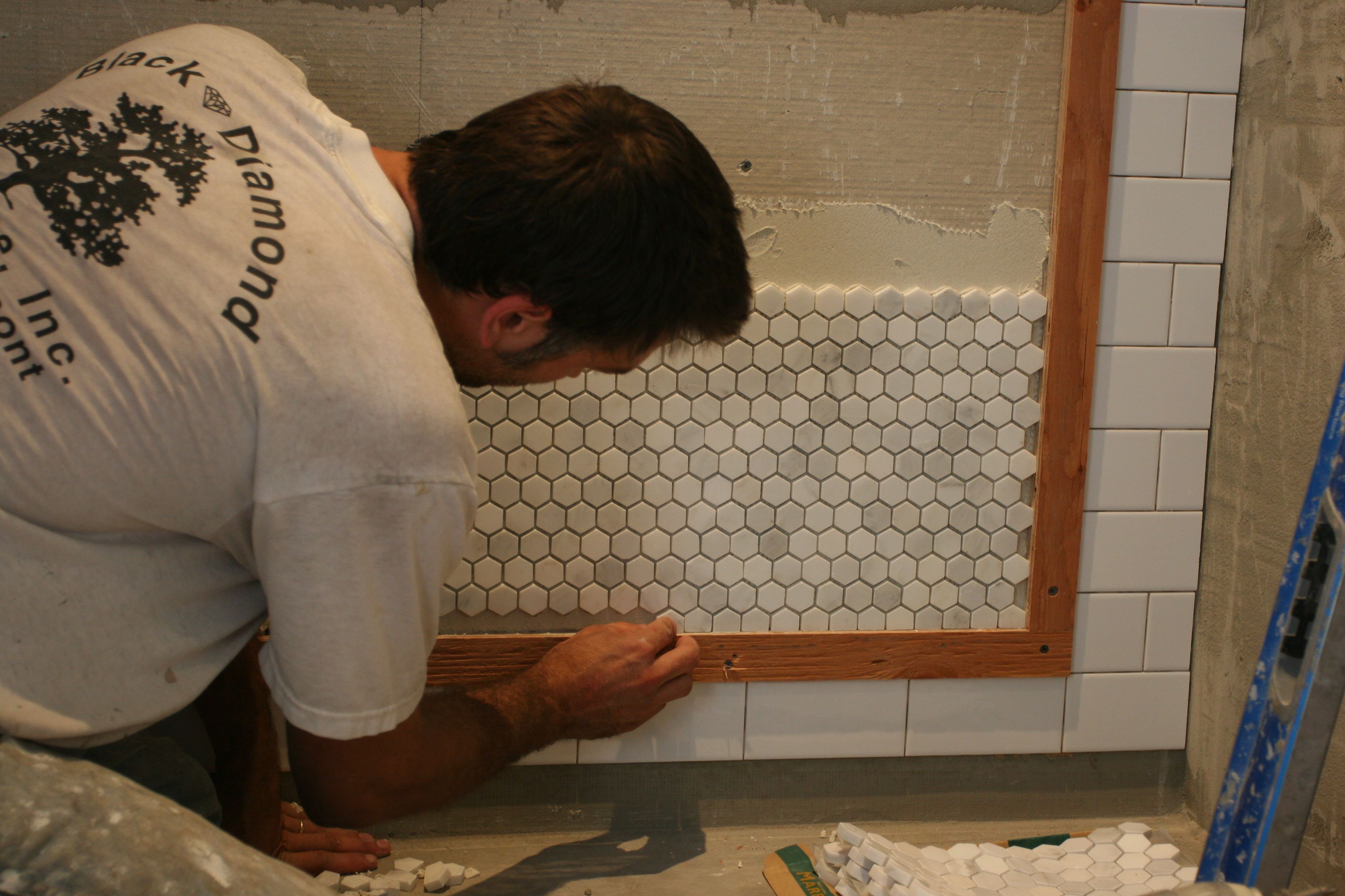 Caleb then had to insert each pre-cut tile into the edges by hand. Thankfully his eye is as skillful as his hand.