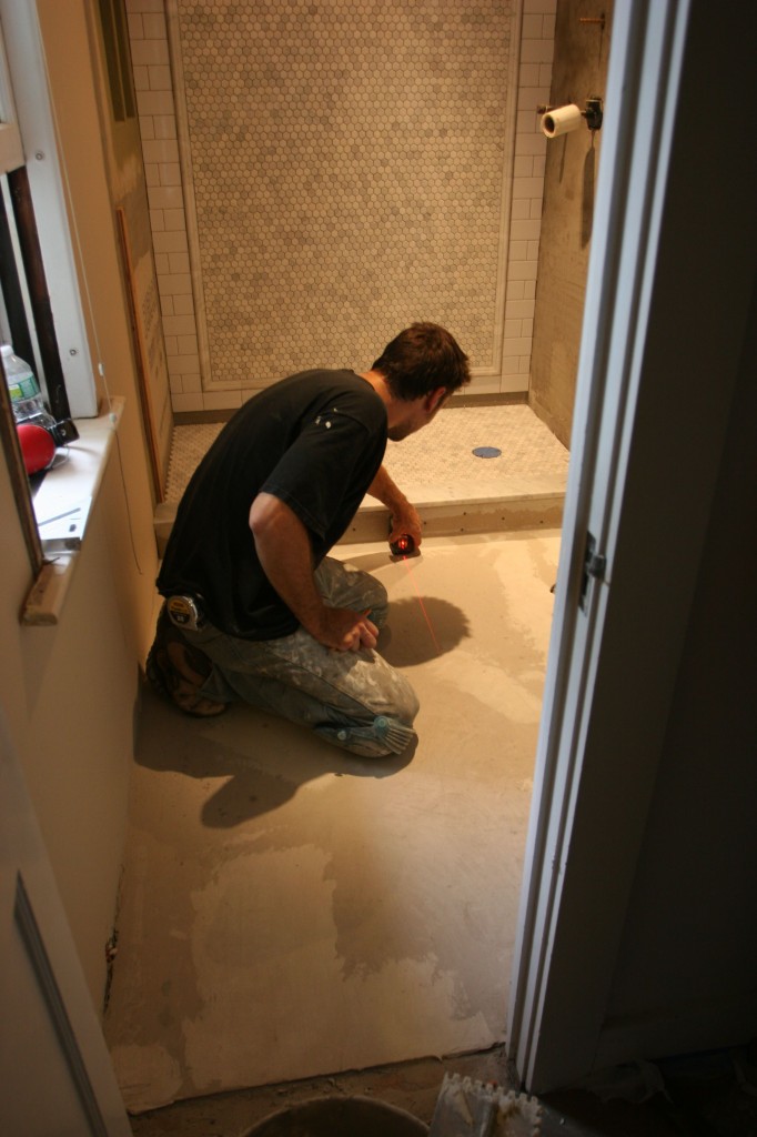 By the time I went to snap some pictures, Caleb had already set the shower floor and threshold. Bam!