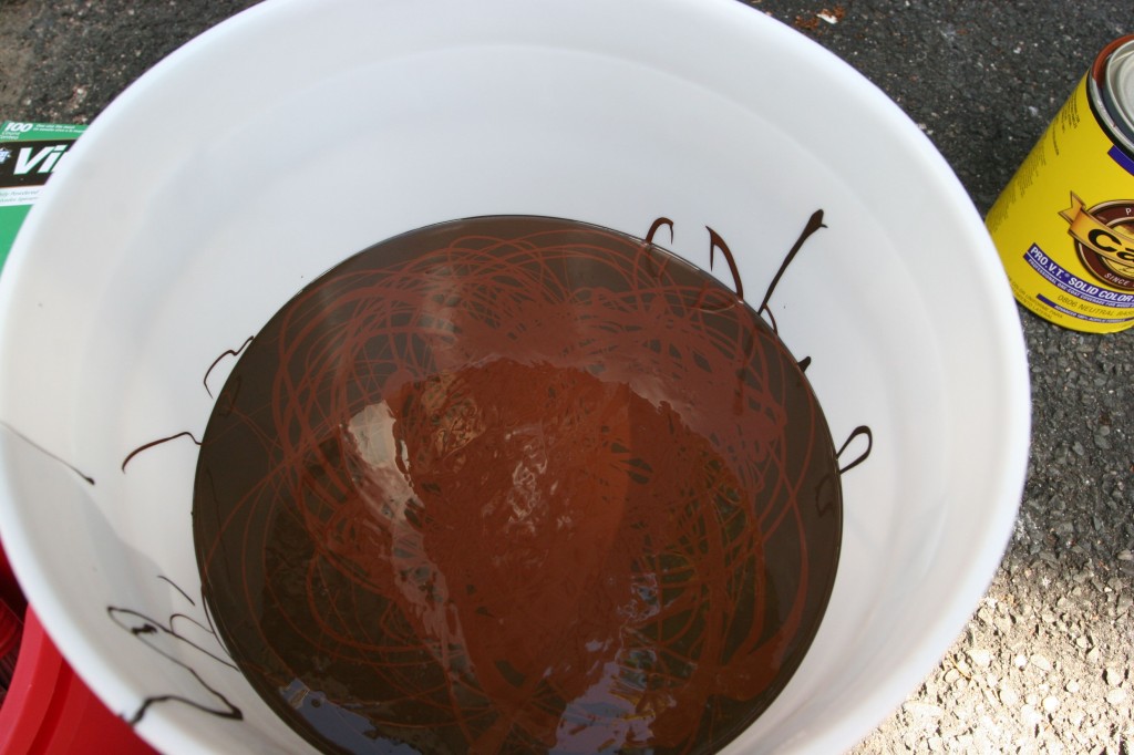 We used one gallon of Cabot solid body stain in "Bark" and one quart in "Mission Brown."