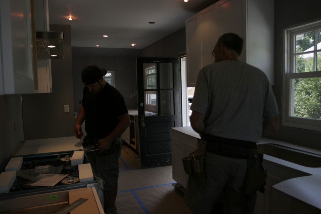 Tom and Dave figuring out the best bracing solutions for the stone that'll surround the slide-in cooktop.