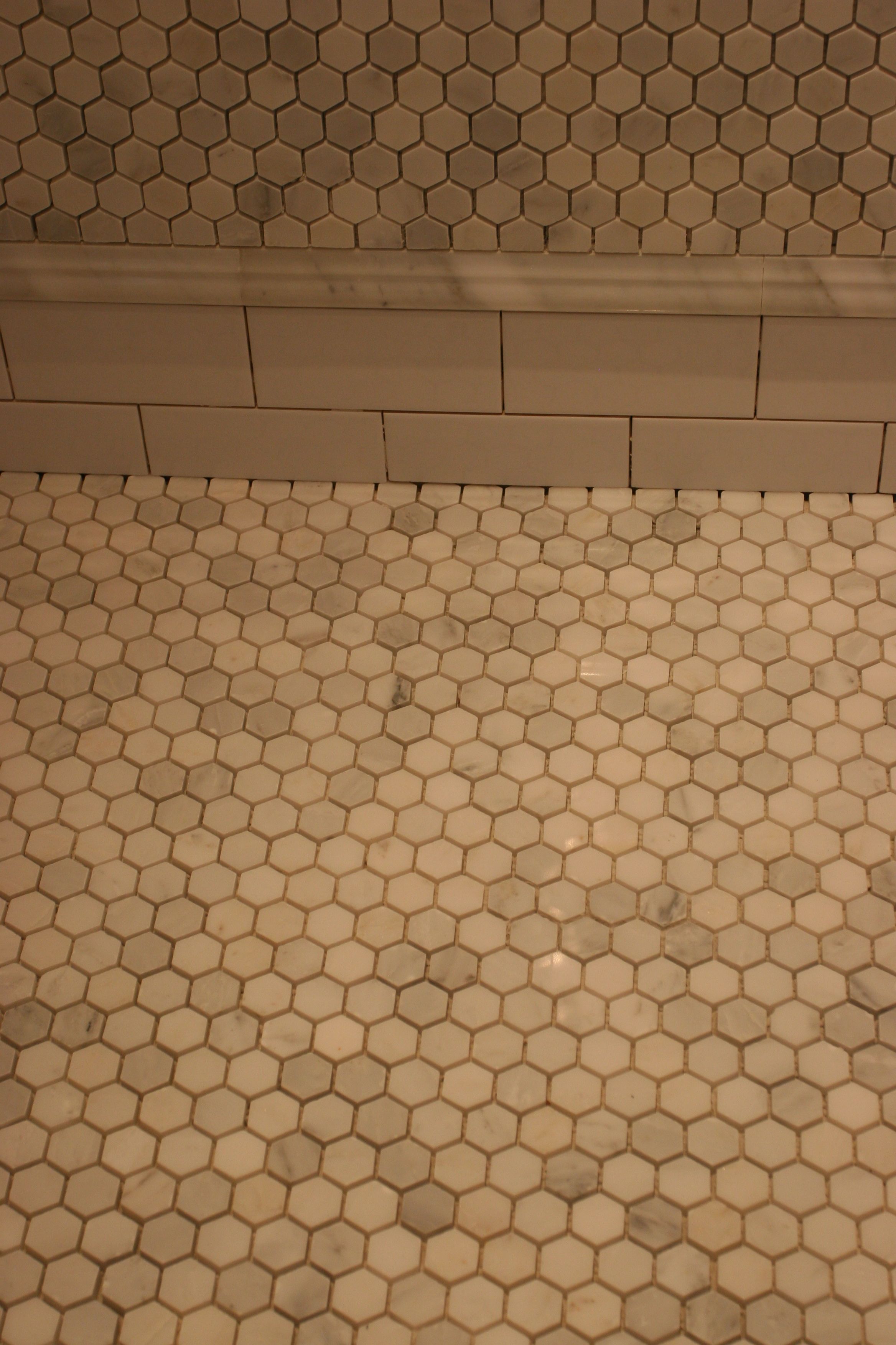 The wall, the skirt, the shower floor. These will look different after the grout goes on tomorrow.
