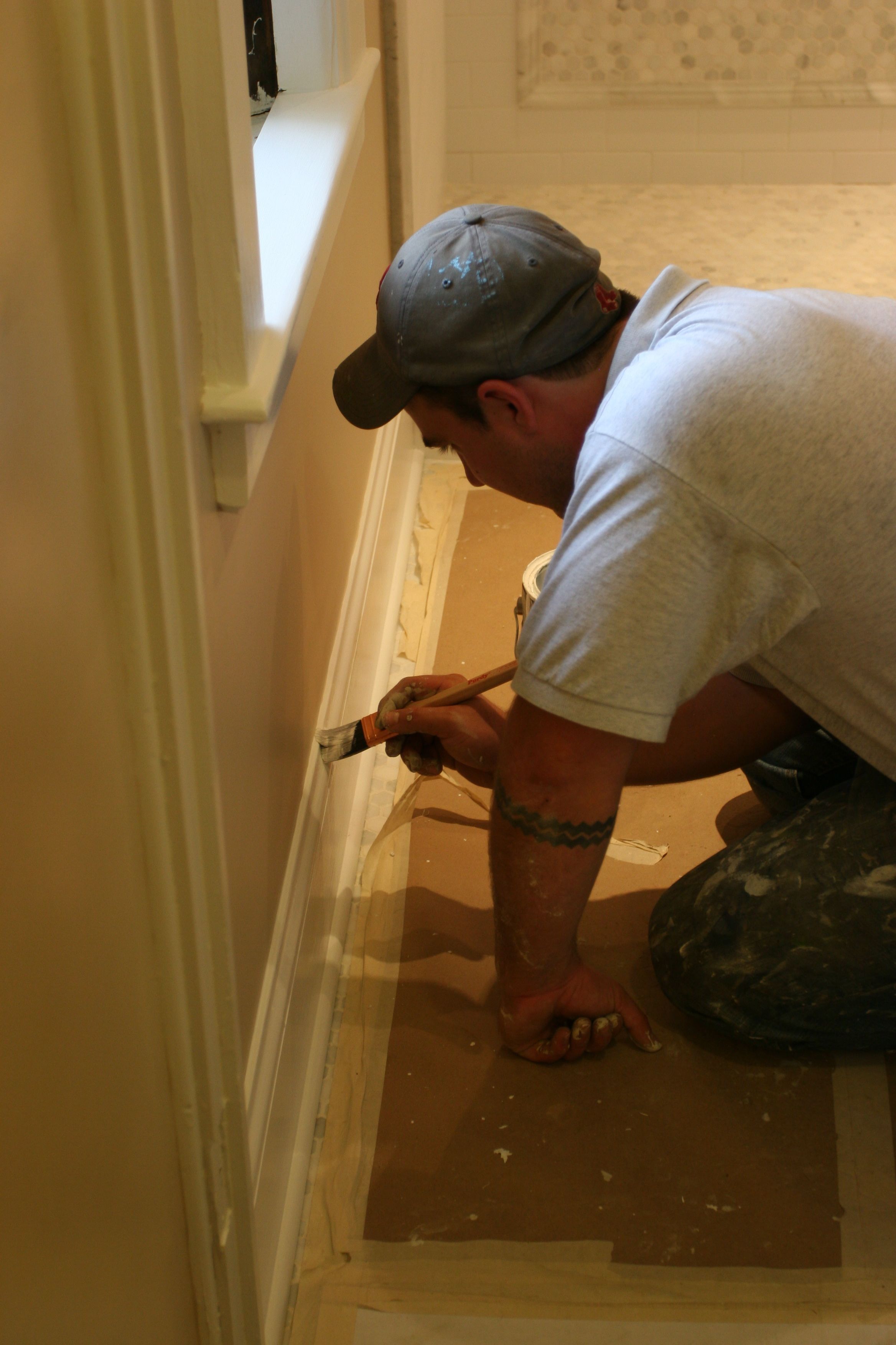 Dave painstakingly straightening out a cut line on the baseboard. This is why we love him so.