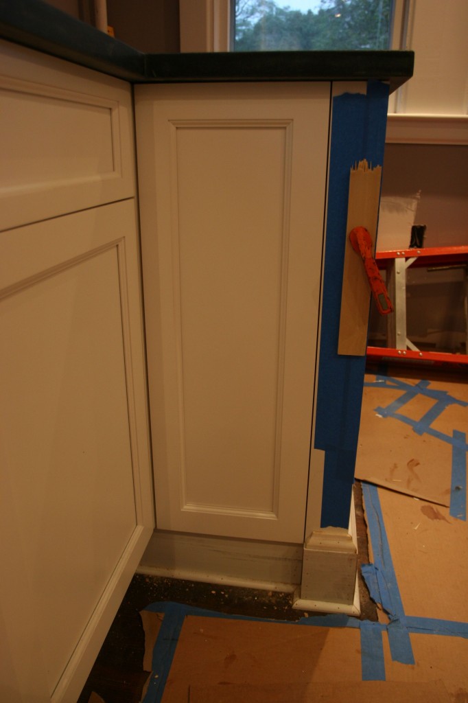 The door panel, cleverly adhered with some silicone and some back-screwing.