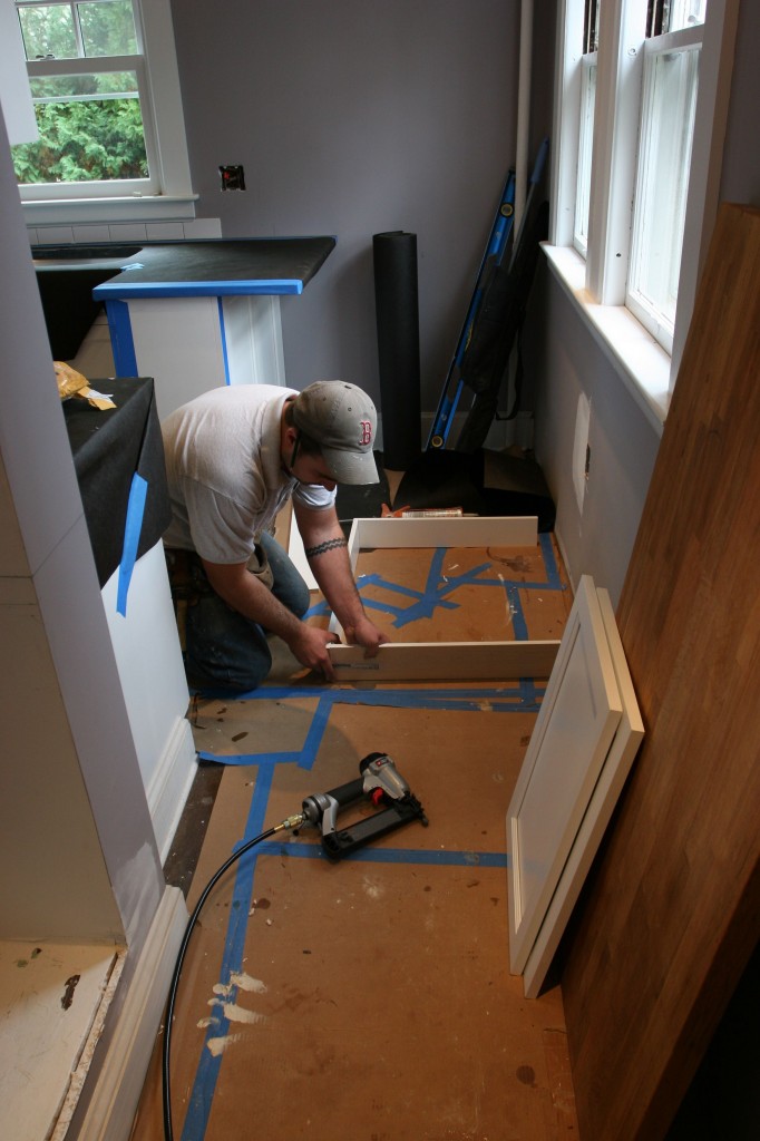 Dave using up some toe-kick material to make a box to hinge the doors onto for the pantry cabinet.