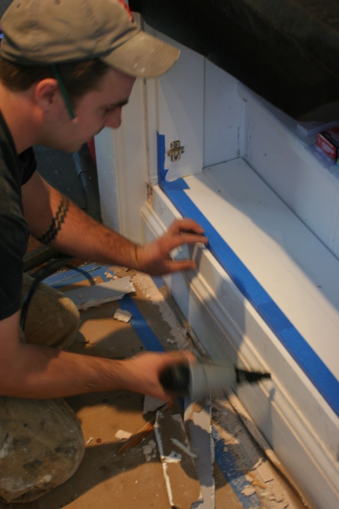 Dave adding a bit of smooth surface to make the pantry look more built-in.