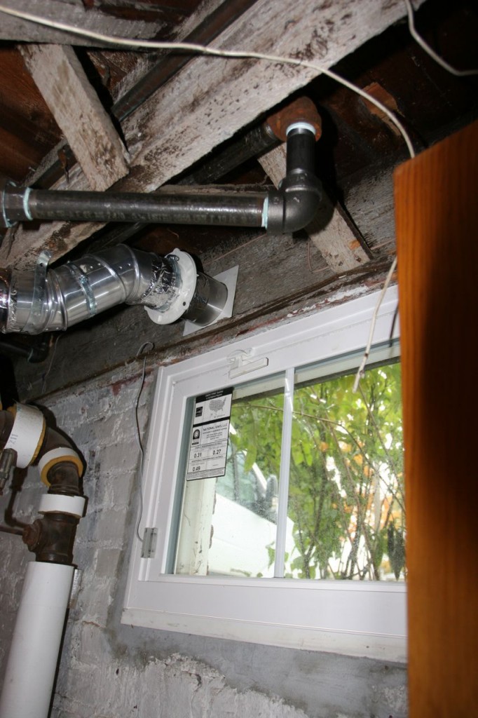 The steam pipe used to impede the window in the laundry room. No more!