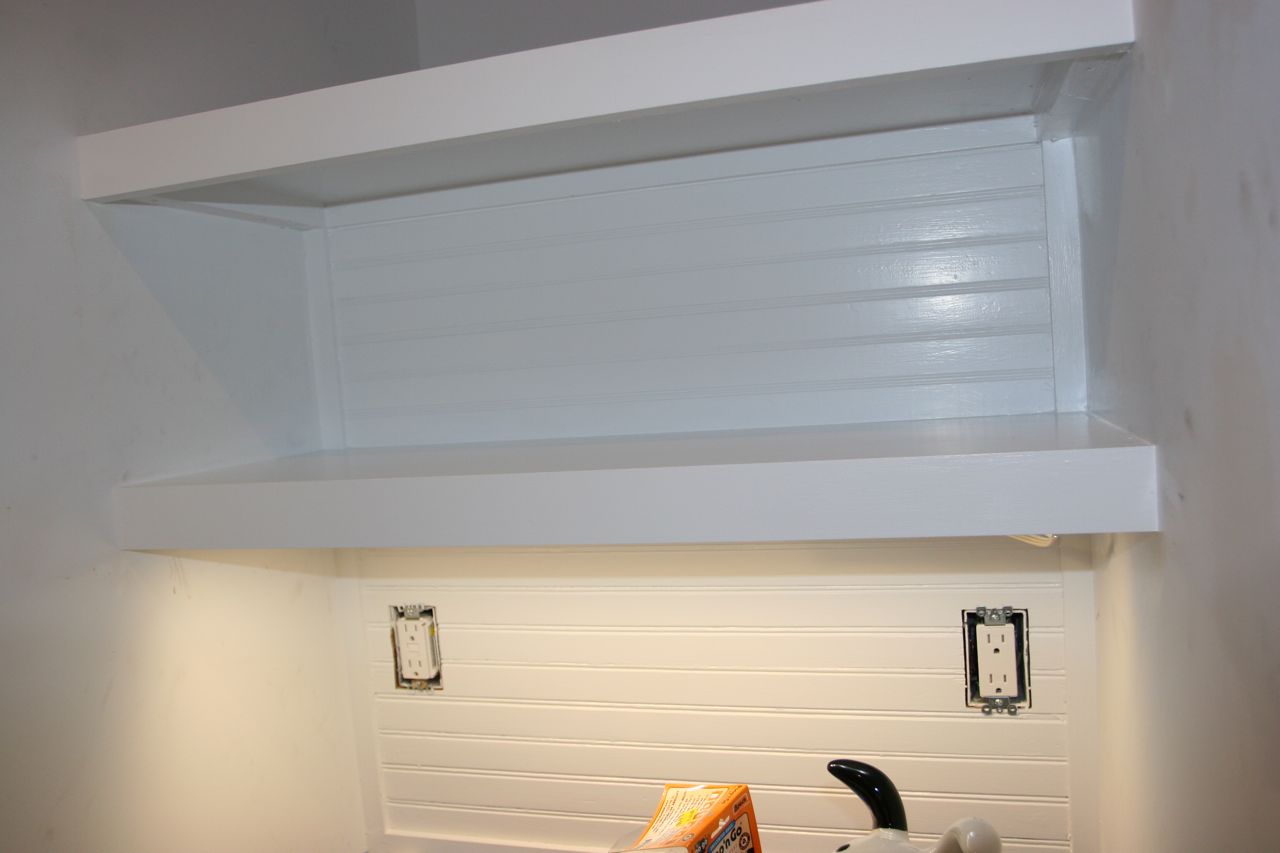 Beadboard: coated with more paint. Undercabinet lights: installed. Outlets: installed. Tea and toast: yes, please!