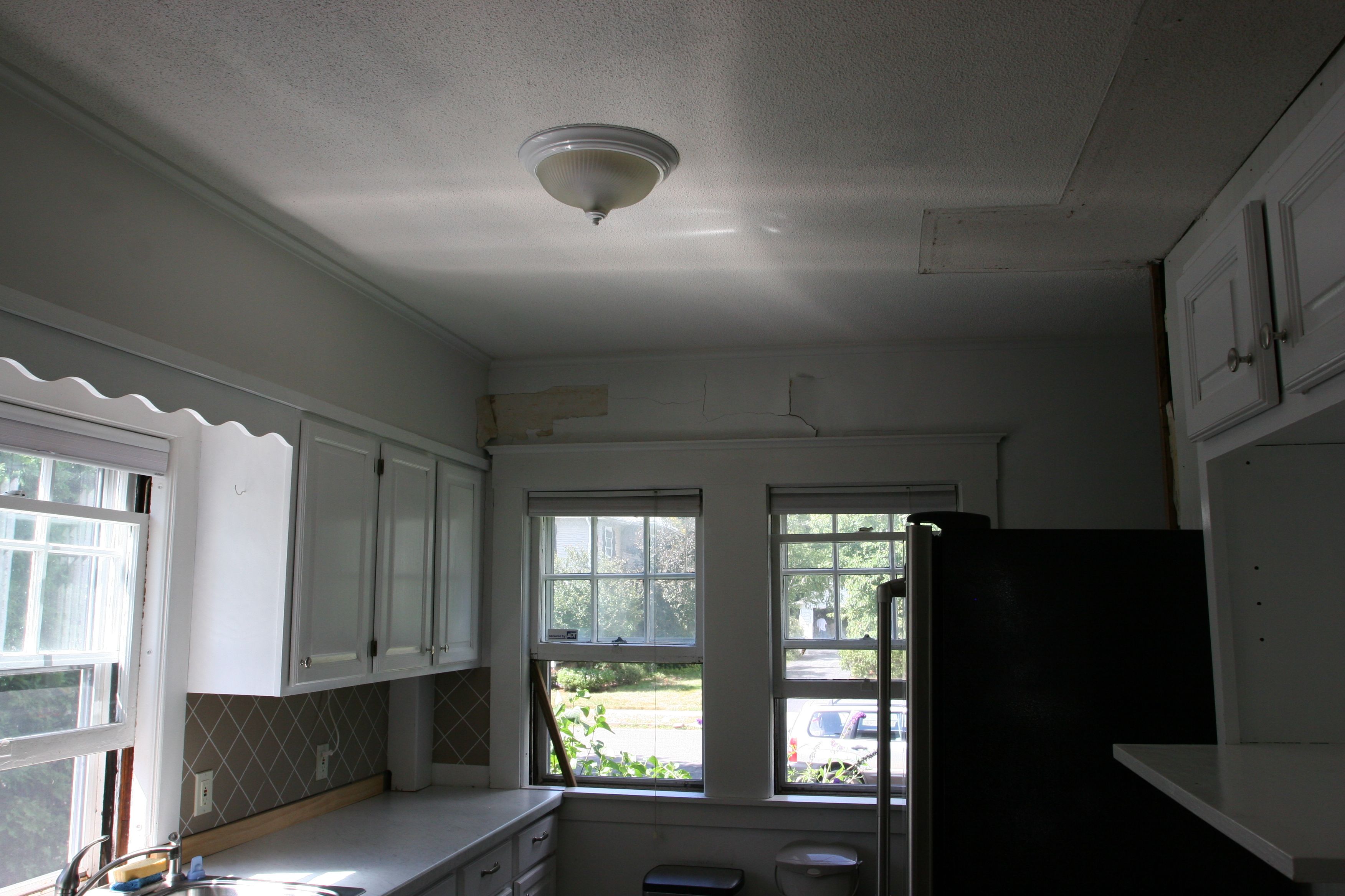 When you looked to the front of the kitchen, the windows were partially obscured by the side of the fridge.