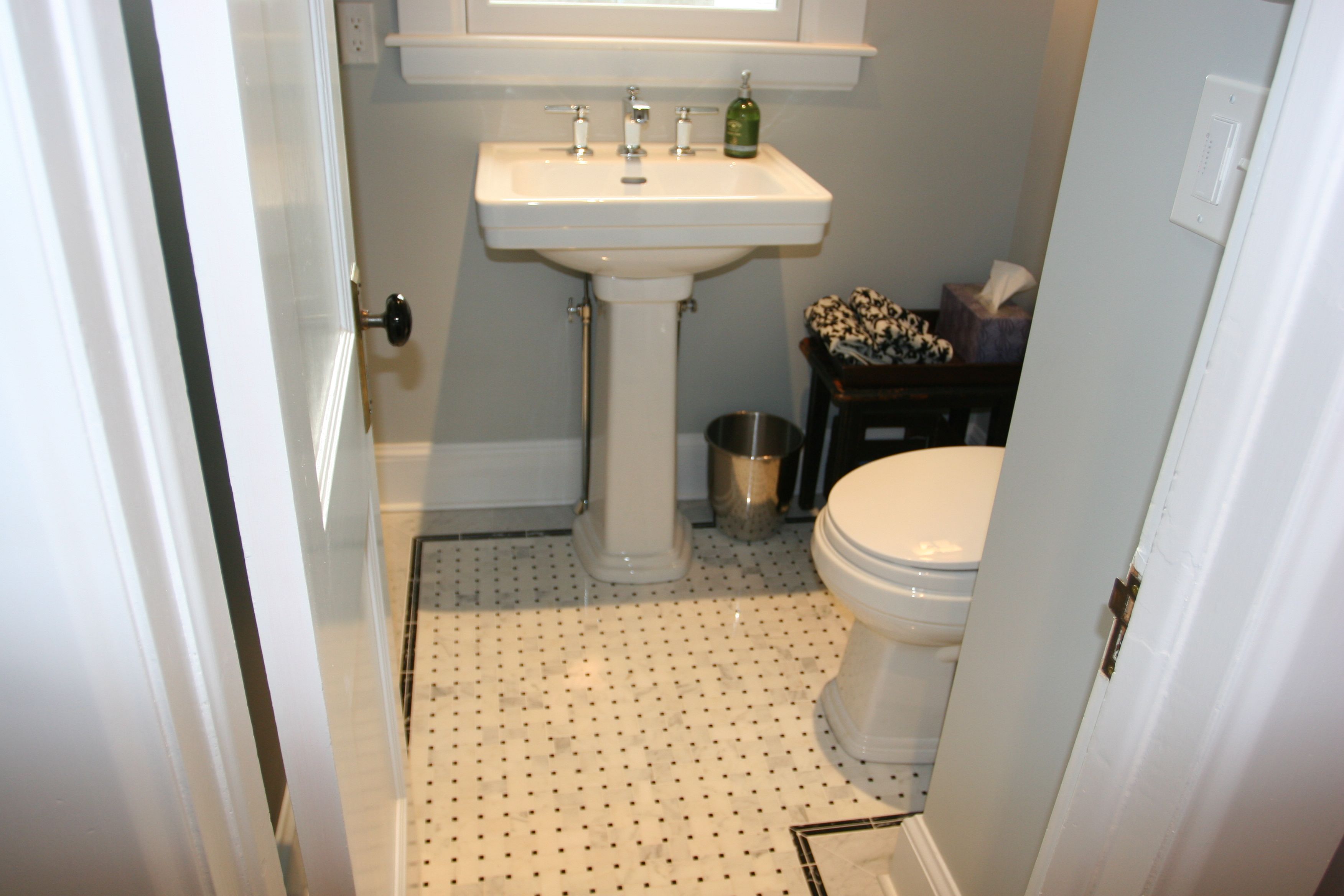 Toto Promenade toilet and sink; Kohler Margeaux faucet. Marble tile basketweave with marble surround. Floor heat by NuHeat.
