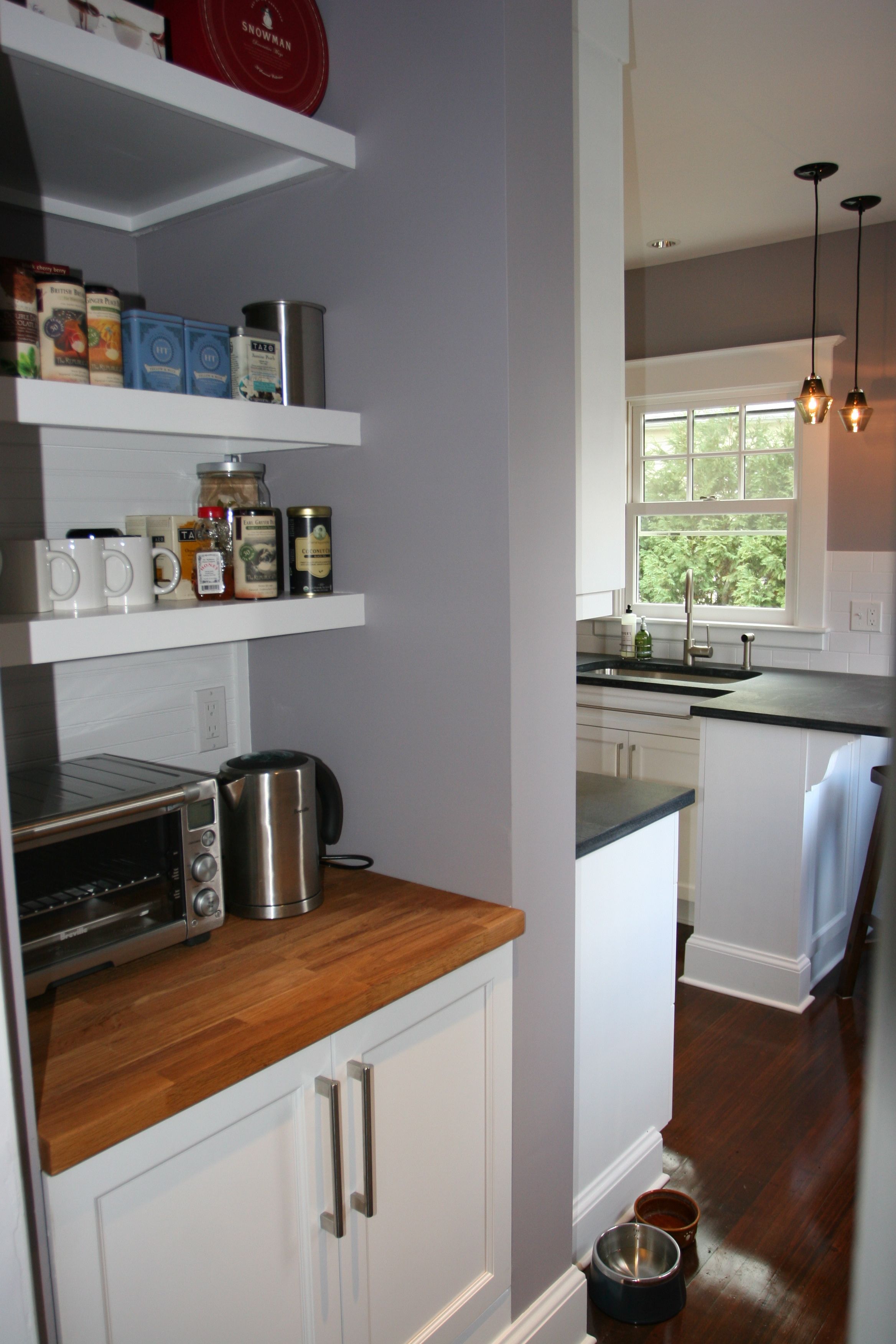 The tea n' toast pantry looks like it's always been there, alongside the stunning kitchen.
