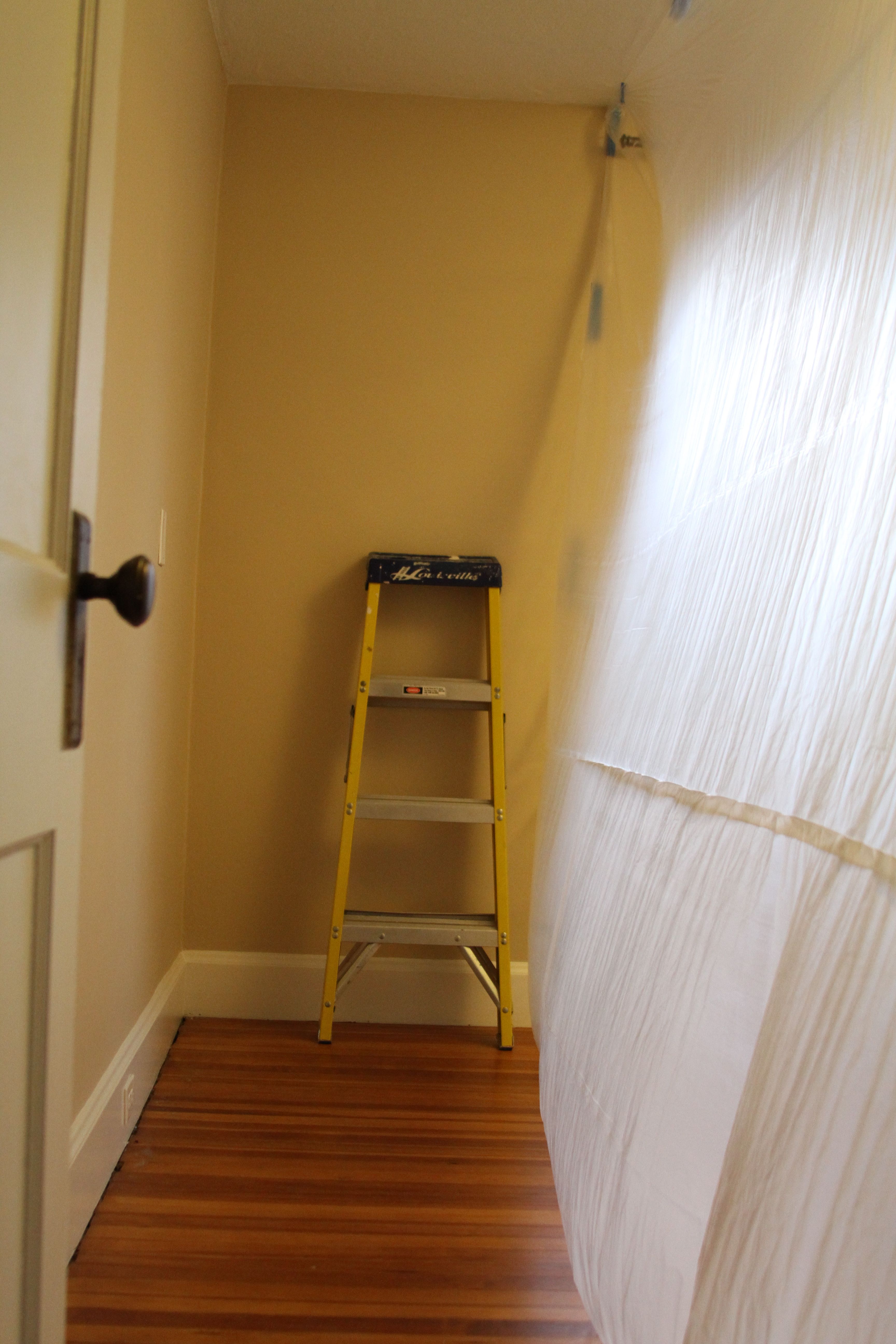 Jeff put up this painter's plastic wall to divide the rest of our bedroom from the work zone. We didn't protect the floors this time, since we knew that we'd need to sleep in this room every night. So I hovered with a broom and vacuum.