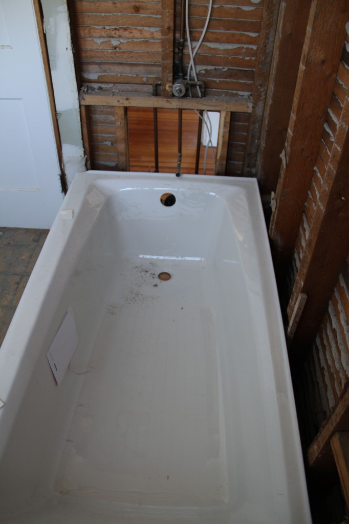 You can see better how the plumbing didn't line up with the new tub. But only barely. Enough to matter.