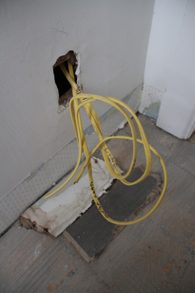 This old hole will house an outlet. We don't need two in the room for code, but since we used to have one here, we thought we should keep one on that wall.