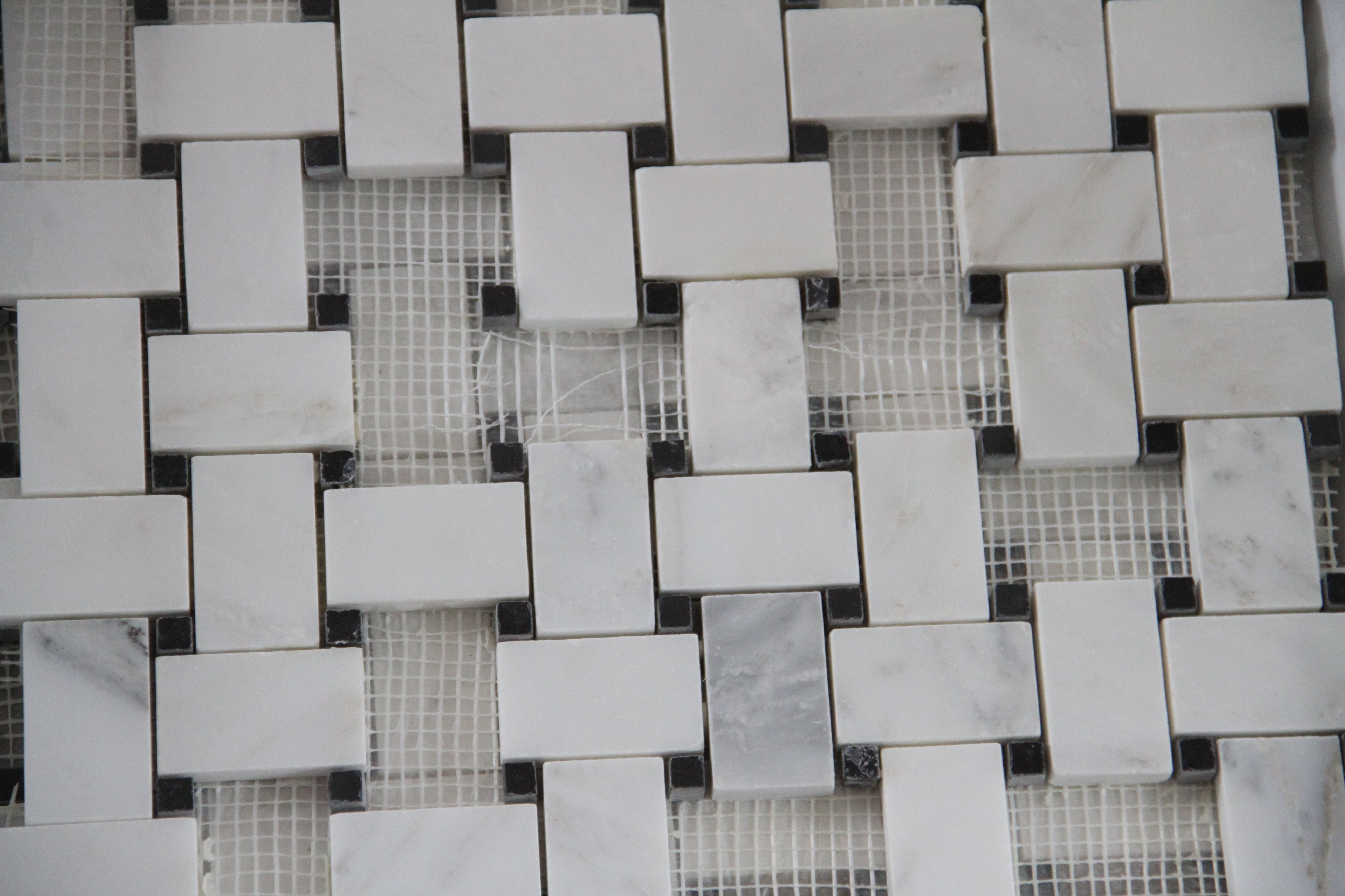 I hand selected tiles from the OTHER mosaic to create little squares. J.J. simply trimmed each one individually.