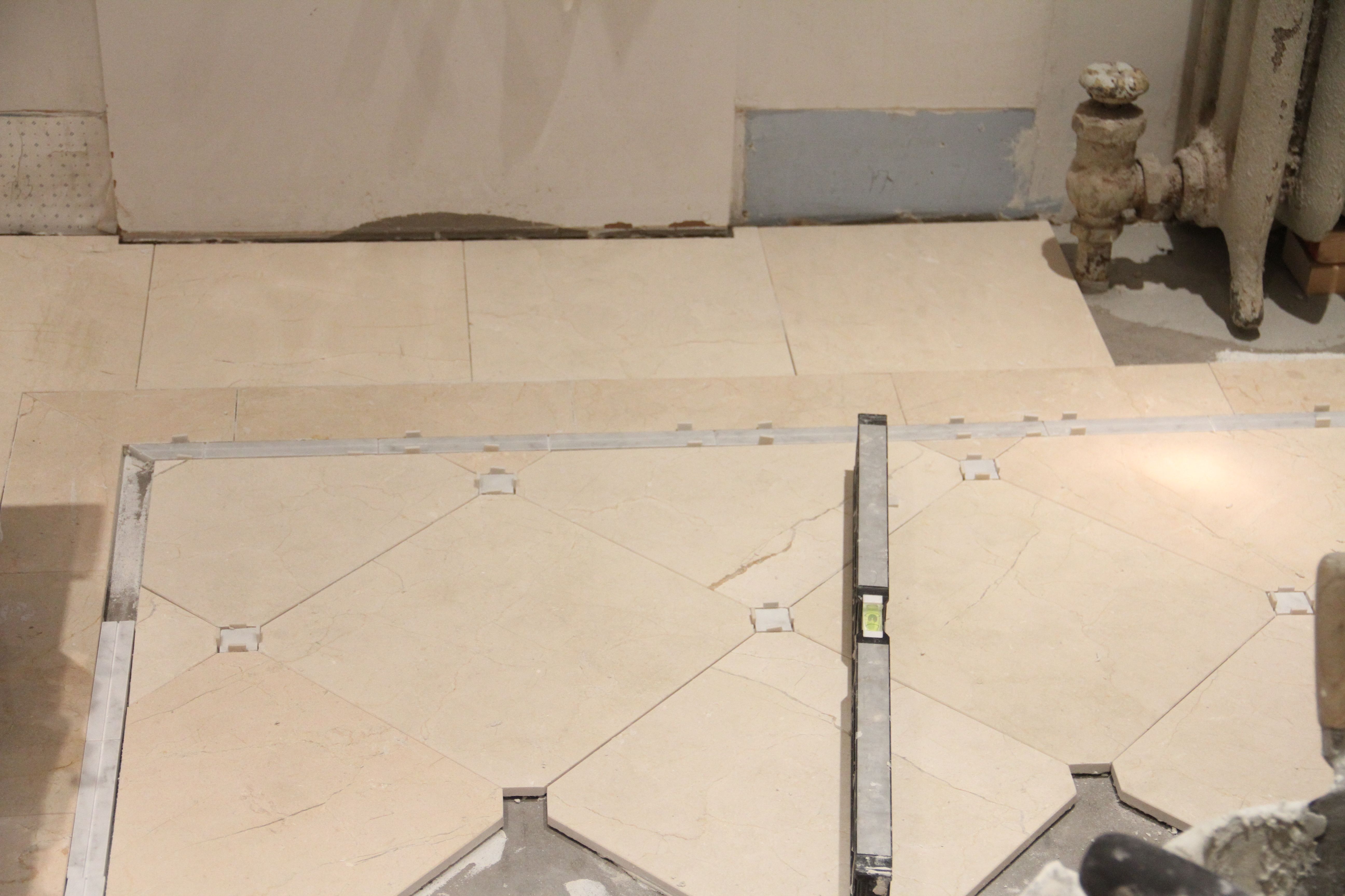 Each area was checked for level with every surrounding piece of tile. That floor is flat, baby!