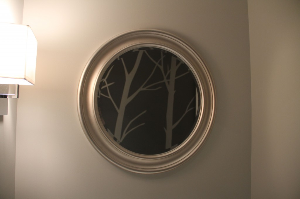 I like how the mirror turns into a little piece of art. And if you're standing there washing your hands, or freshening up, you can see out the window through the mirror, too, to all the giant maple trees in the surrounding yards.