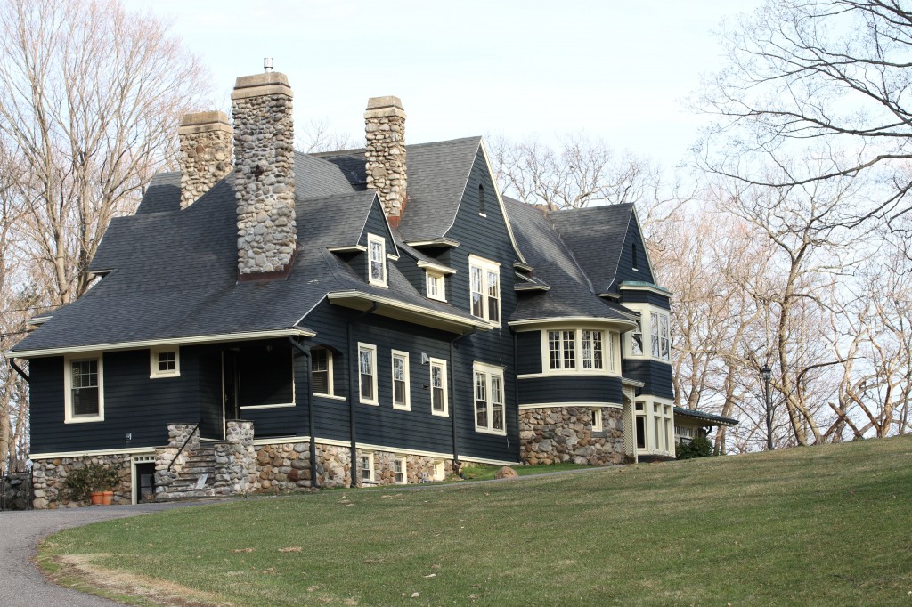 One of the giant, gorgeous homes near ours. I love, love, LOVE the siding! The color, the pattern (I'm swooning here), the stone-work... The trim color could use some adjusting, but it's a stunning home from an era long gone by.