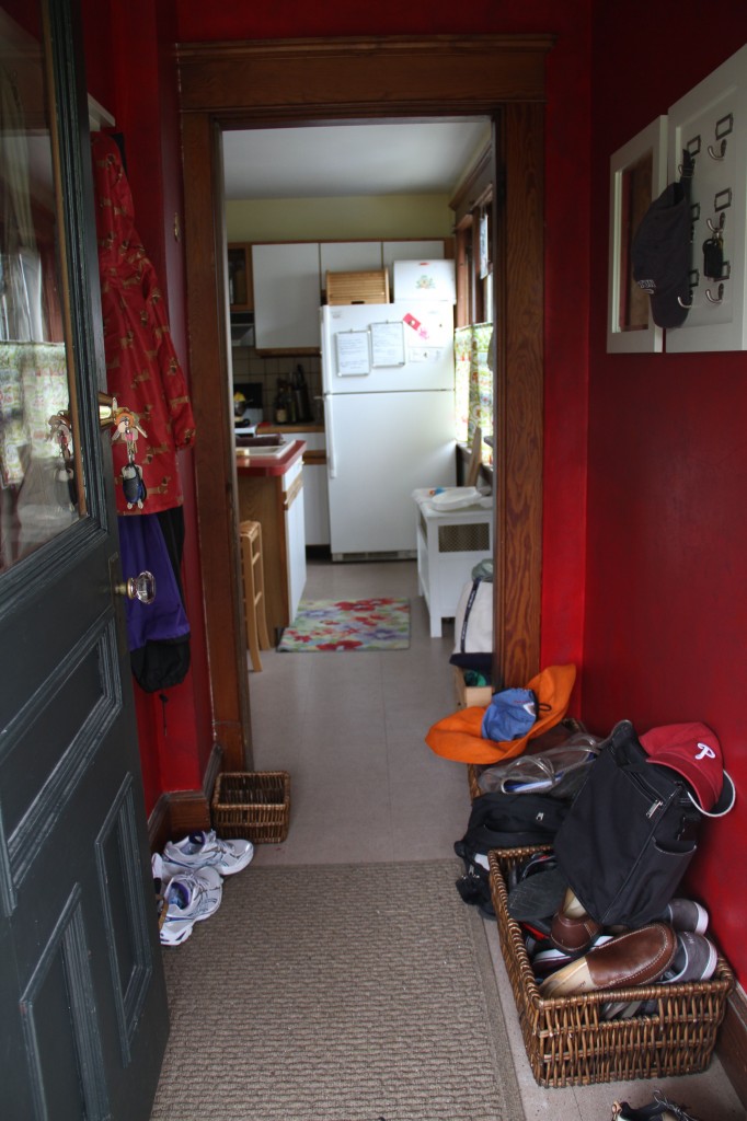 BEFORE: entryway. The well-loved kitchen is entered upon through a small mudroom/entryway. Anyone who lives in New England knows that this space is essential, and will act as the main entryway for the whole house half the year.