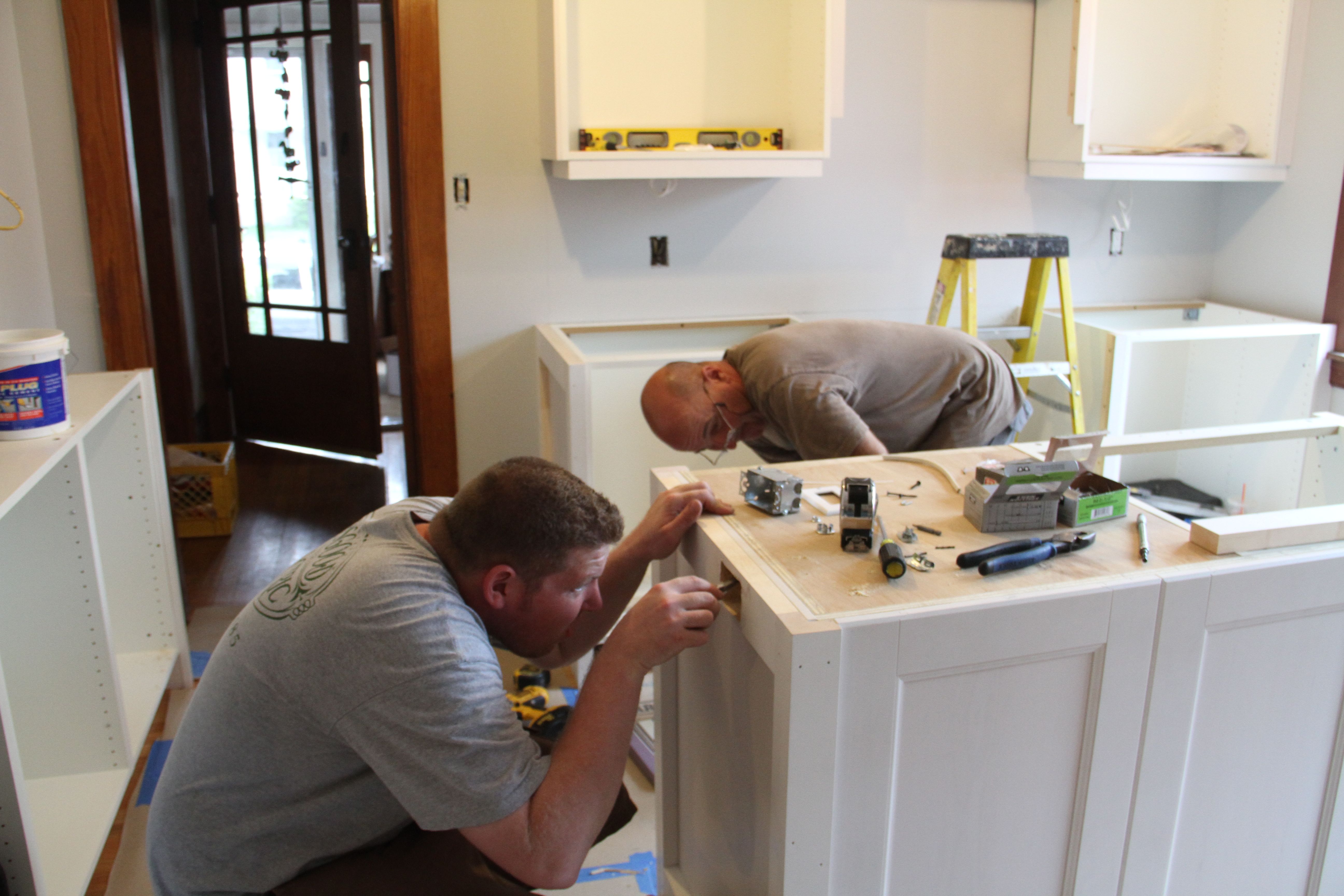 Brad installing a required outlet on the island. Pappy approved of Brad's skills. And that's saying something.