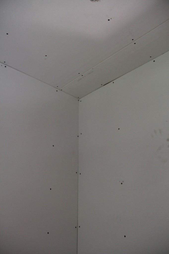 A bit of an optical illusion. But mainly it's just a shot of the tremendous amount of screws needed in proper drywall installation. All of those had to be covered with mud and sanded.