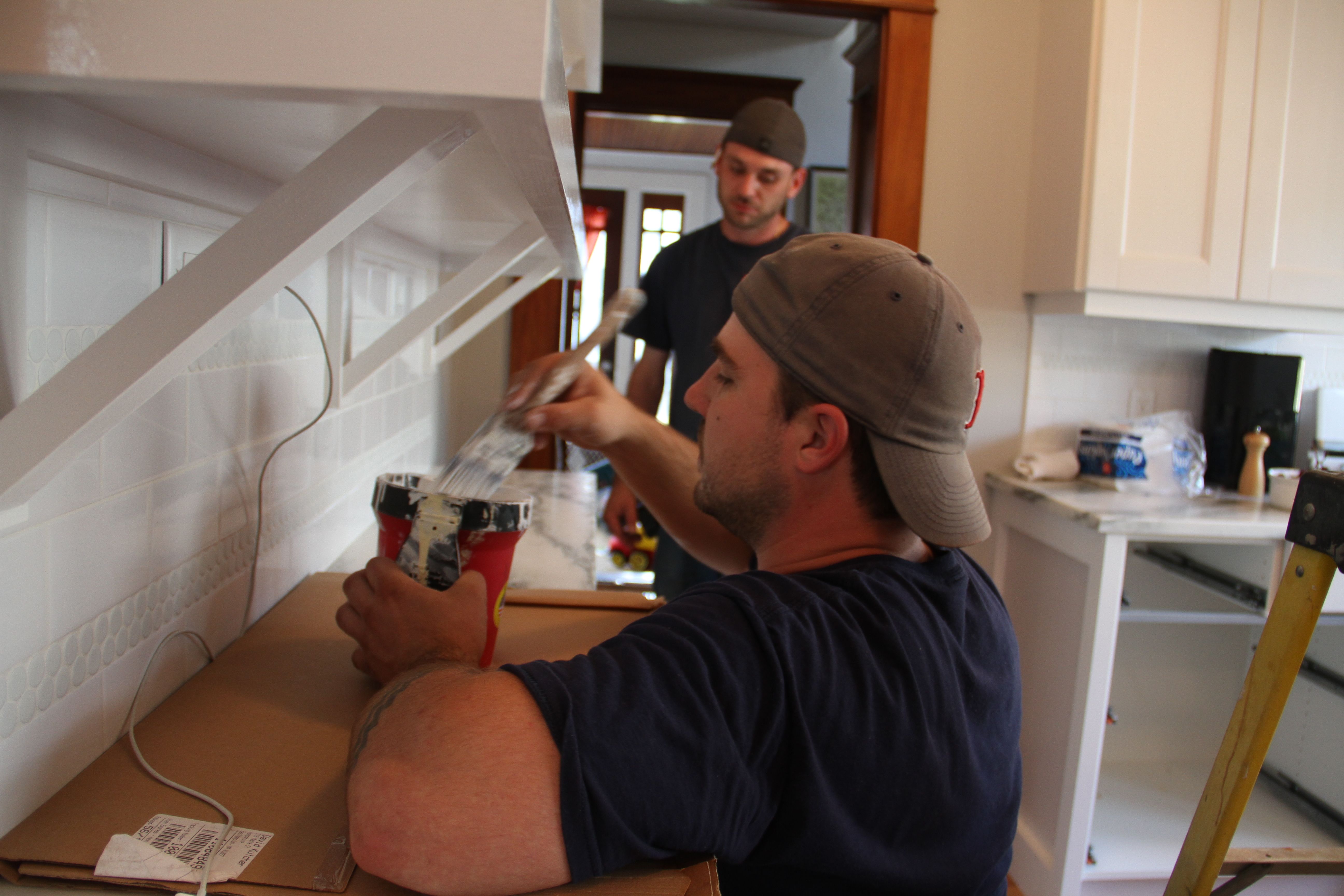 Dave and Jonas working away to finish up the minor details that make the kitchen go from in-progress to done!