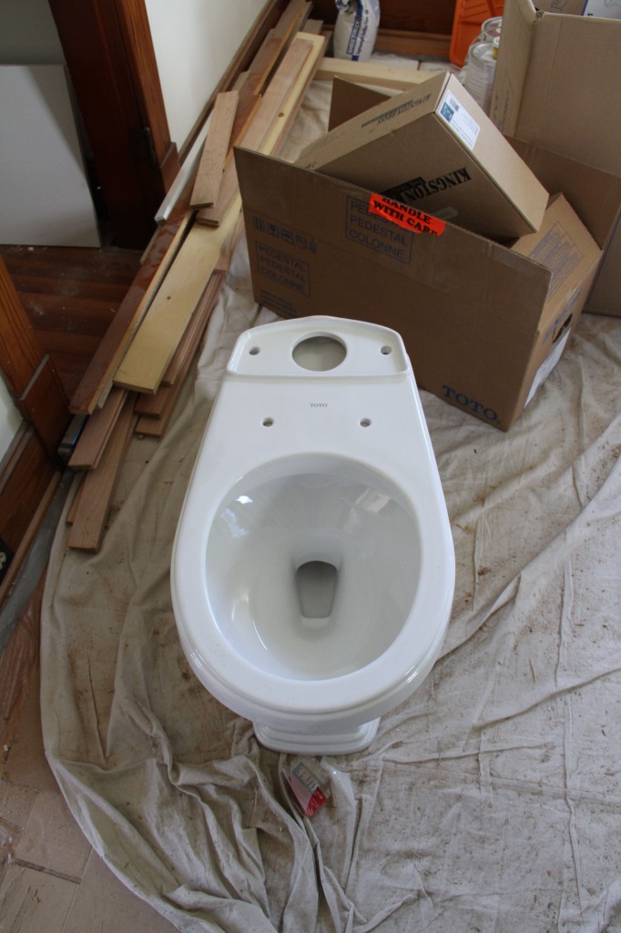 The toilet, sans tank. Official signs that things are moving toward finish.