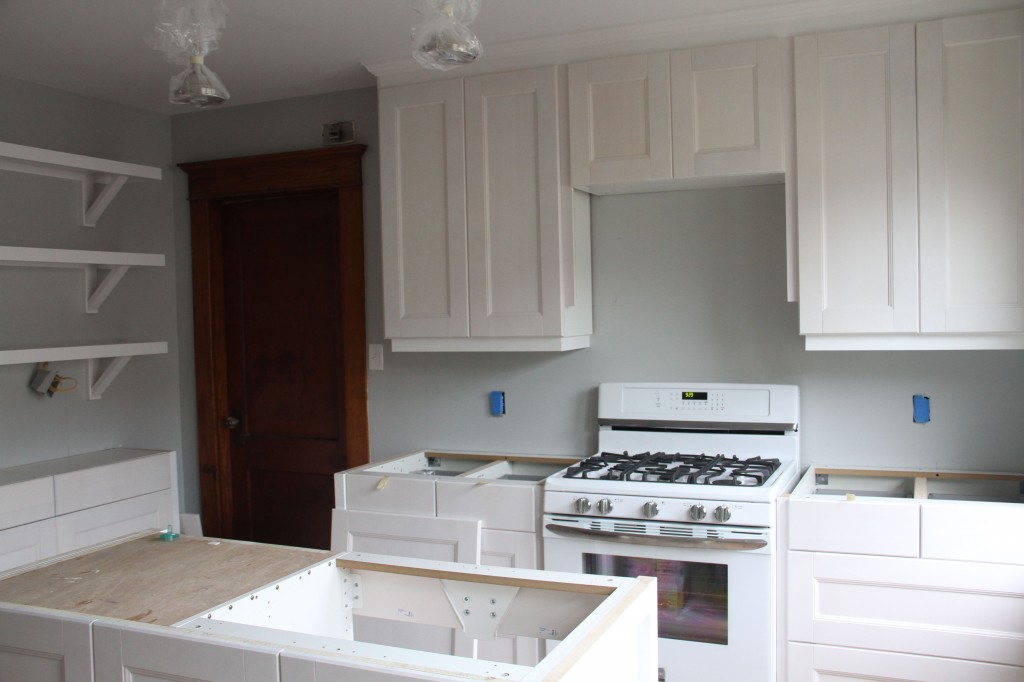 Mr and Mrs K were busy putting on door and drawer fronts, and receiving their lovely new stove! Quite the upgrade!