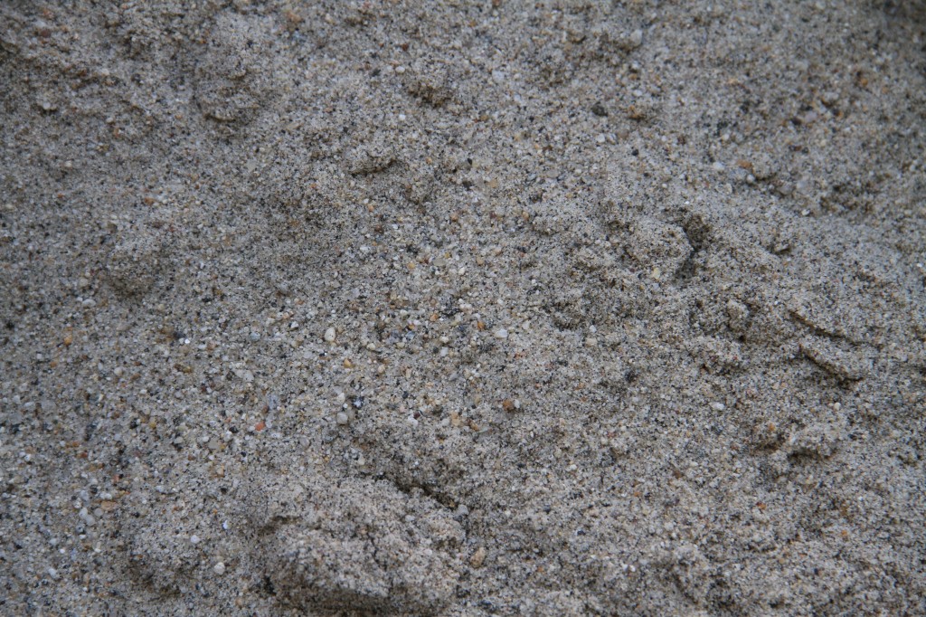 Beauty shot: sand. Reminds me simultaneously of the beach and icy sidewalks.