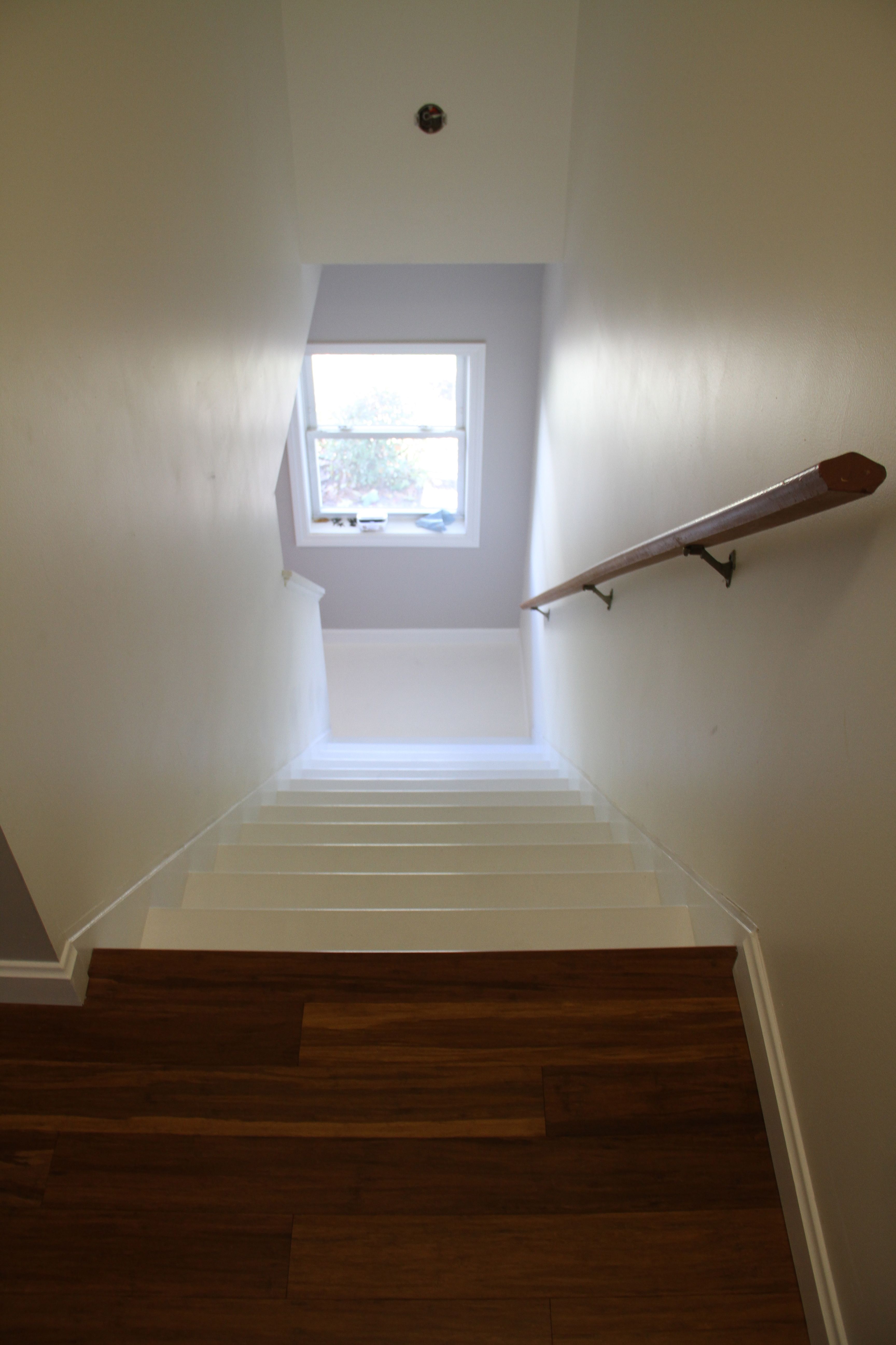 AFTER: Staircase, refreshed with paint, caulking, sanding and several hours (and days) on my knees.