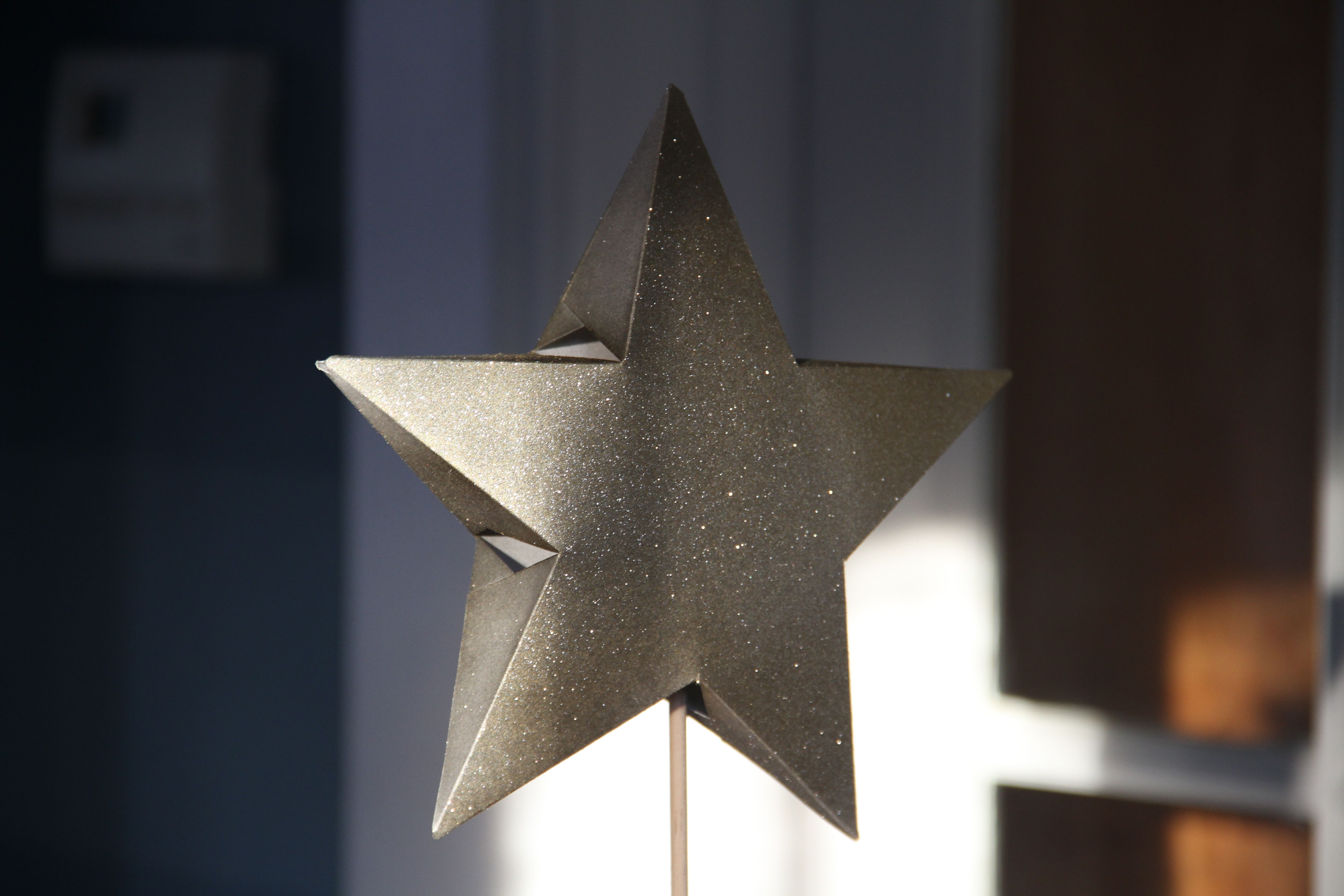My star. When I was in 2nd or 3rd grade I "figured out" how to make this (I thought I had invented something amazing). The star is merely resting on one of the dowels I had for the trees - it stands alone and slips around the top of the tree when used as a topper.