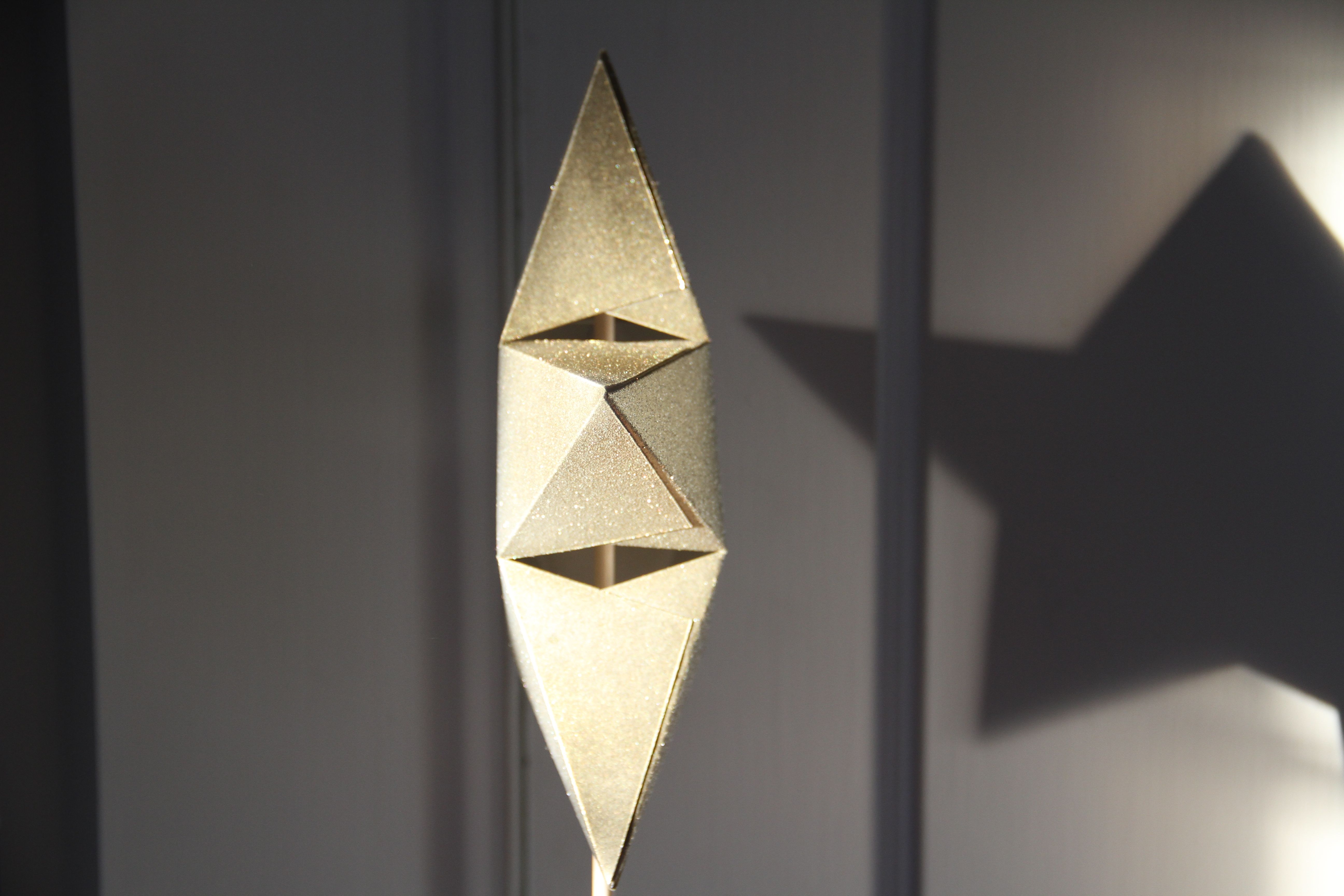 Side view of the star. I made this out of card stock, which I also later sprayed with gold, silver and glitter spray paint. It's a 2-sided, 3 dimensional piece held together by glue stick, patience and luck.