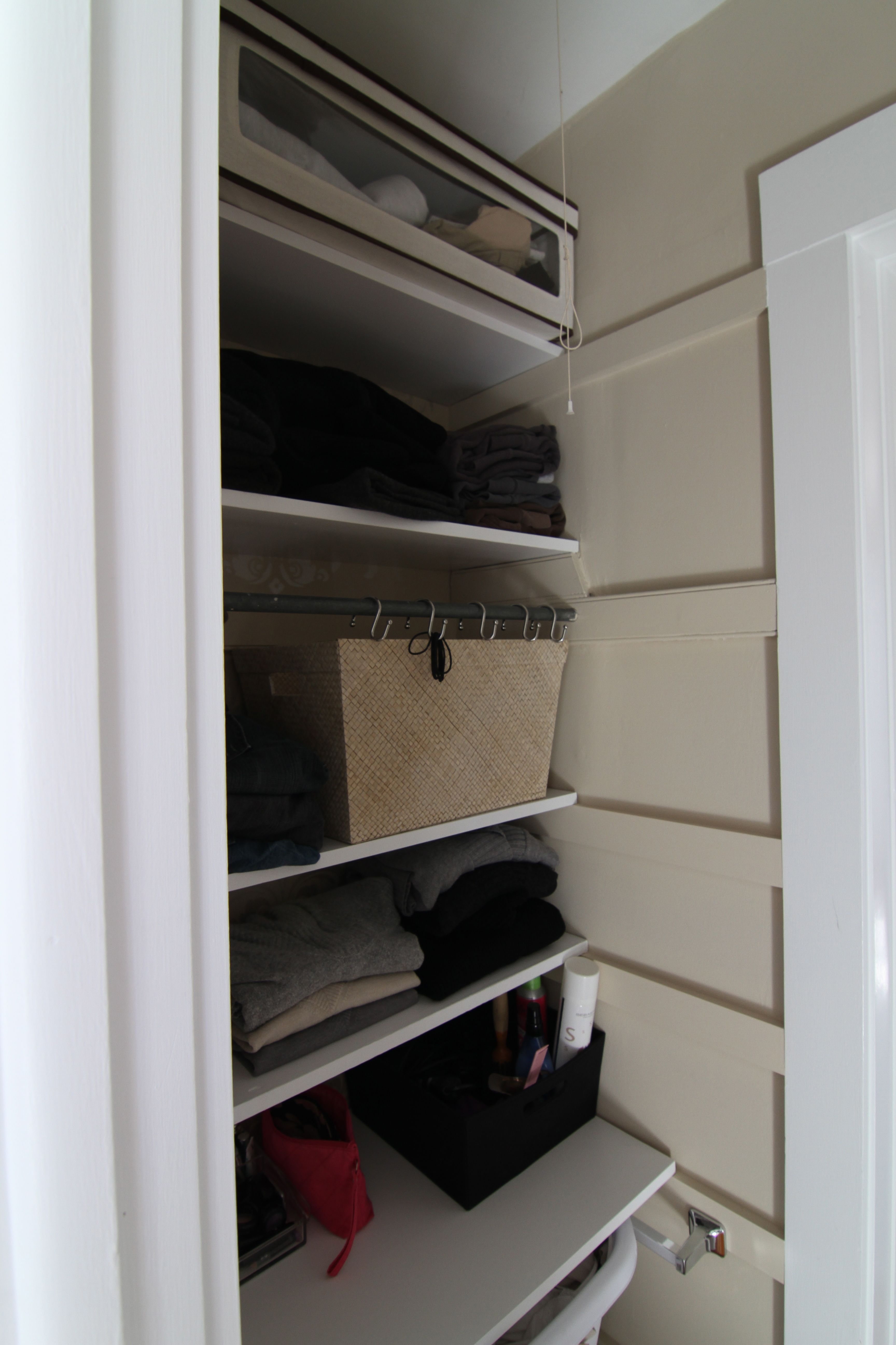 AFTER: The original skirt boards and the new ones seem to blend well enough, but since none of the shelves are affixed this closet can go back to hanging storage as the need arises.