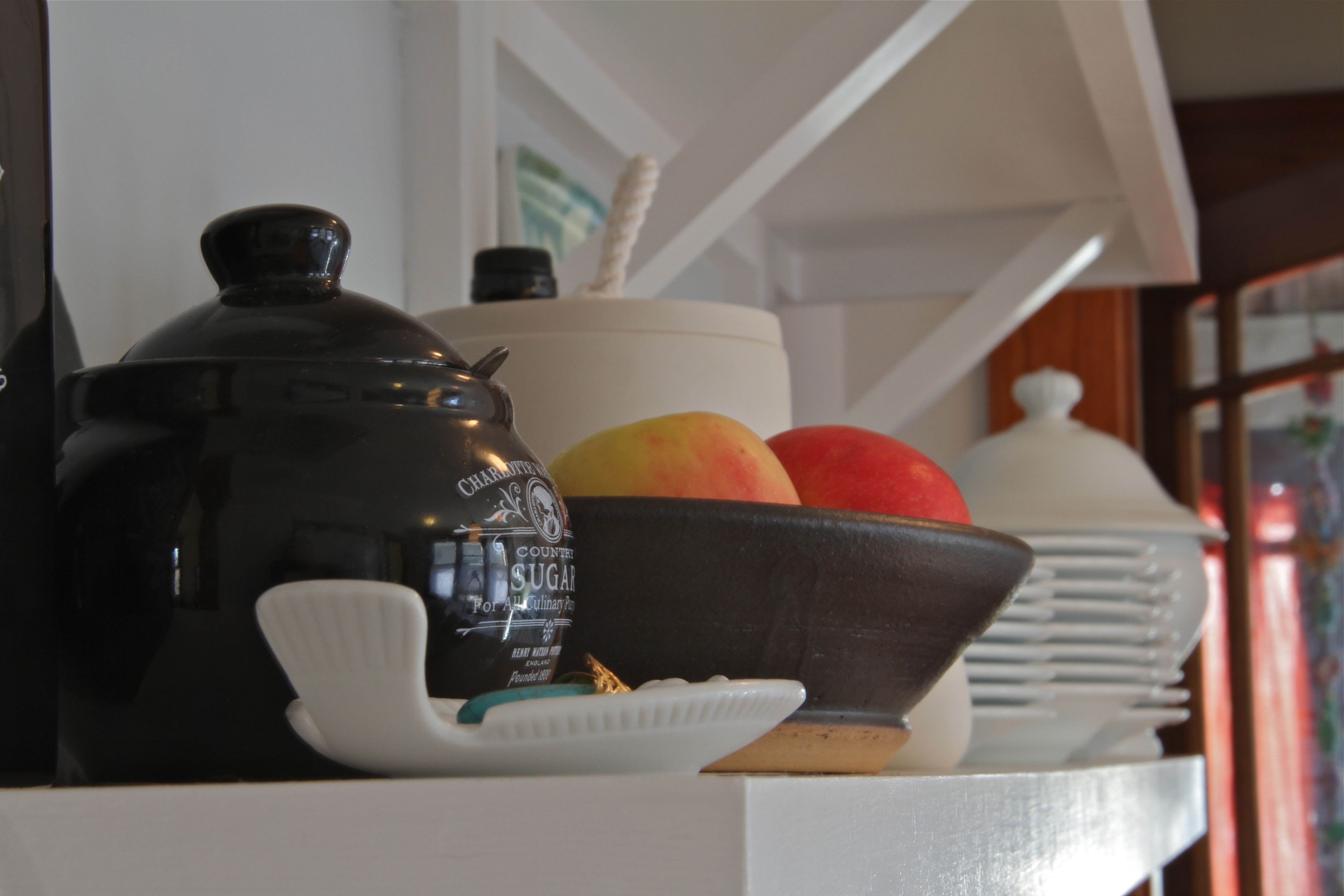 AFTER: Beauty shot - open shelves with lovely display of keepsakes and useful day-to-day kitchenware.