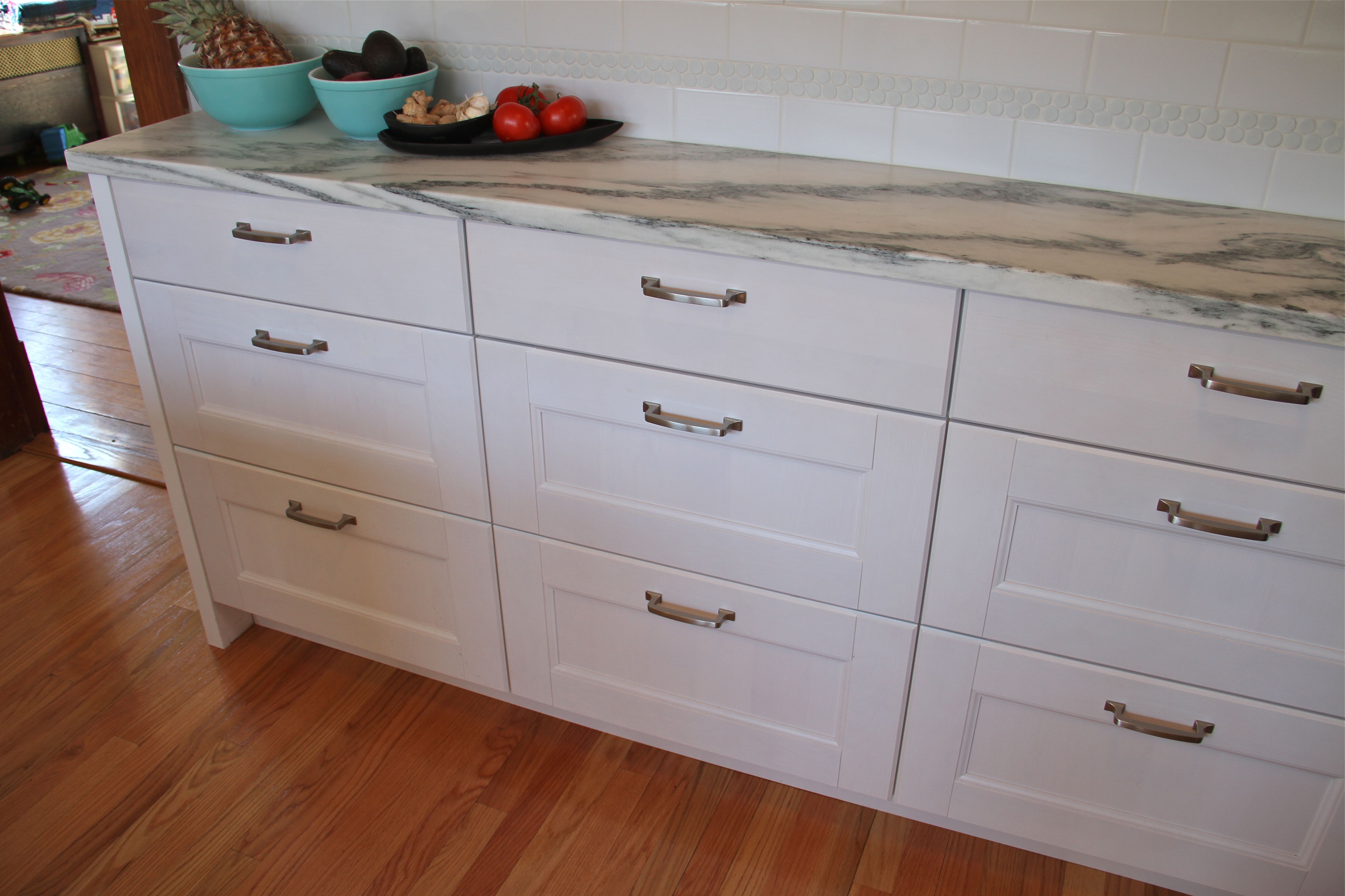 AFTER: Mr and Mrs K were able to find shallow depth lower cabinets in completely non-custom IKEA cabinetry (which was dressed up a bit by Team Carpentry).