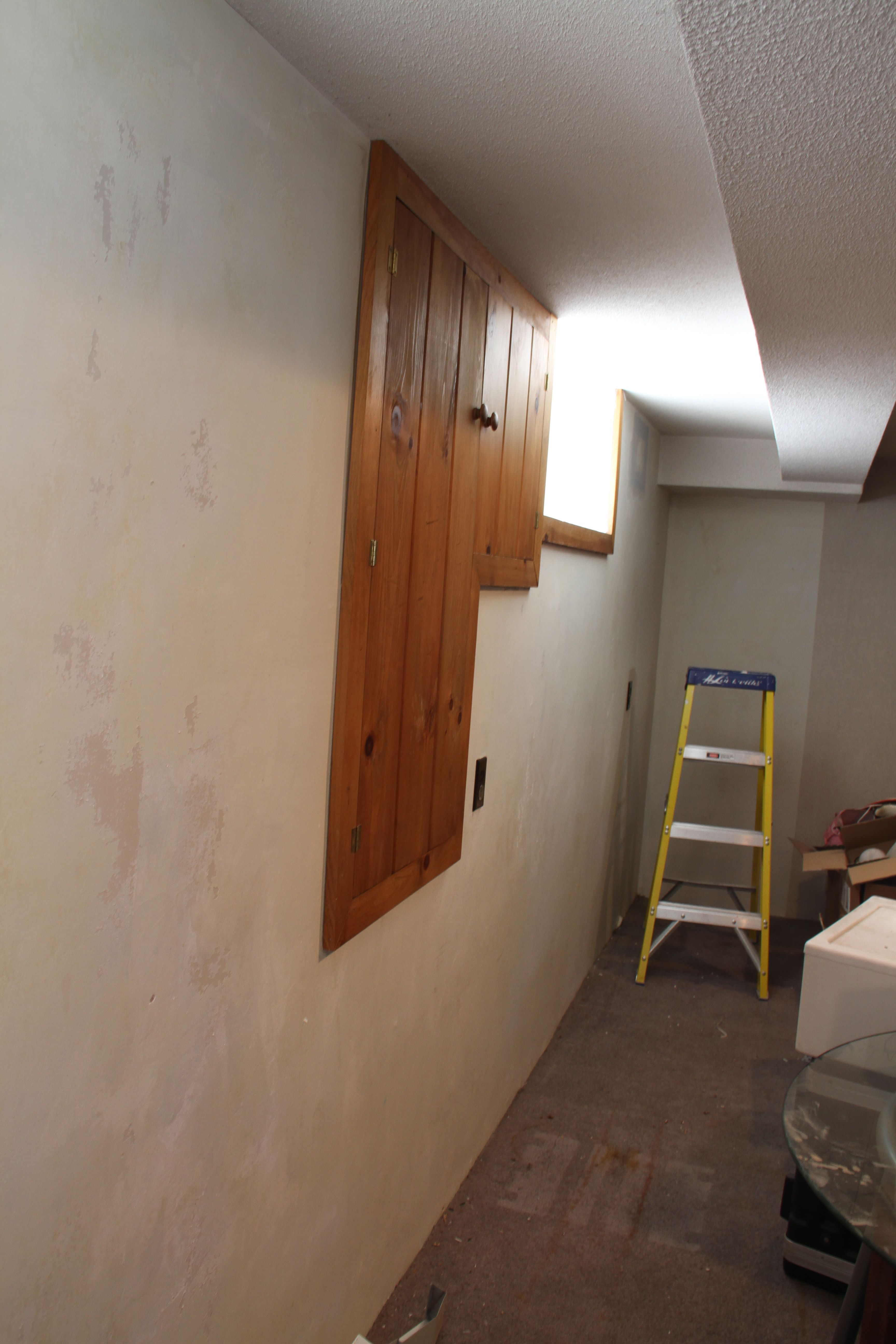 The walls are not smooth like brand new drywall. The wallpaper had been put directly onto unprimed sheetrock making the glue virtually impossible to remove with a chemical.