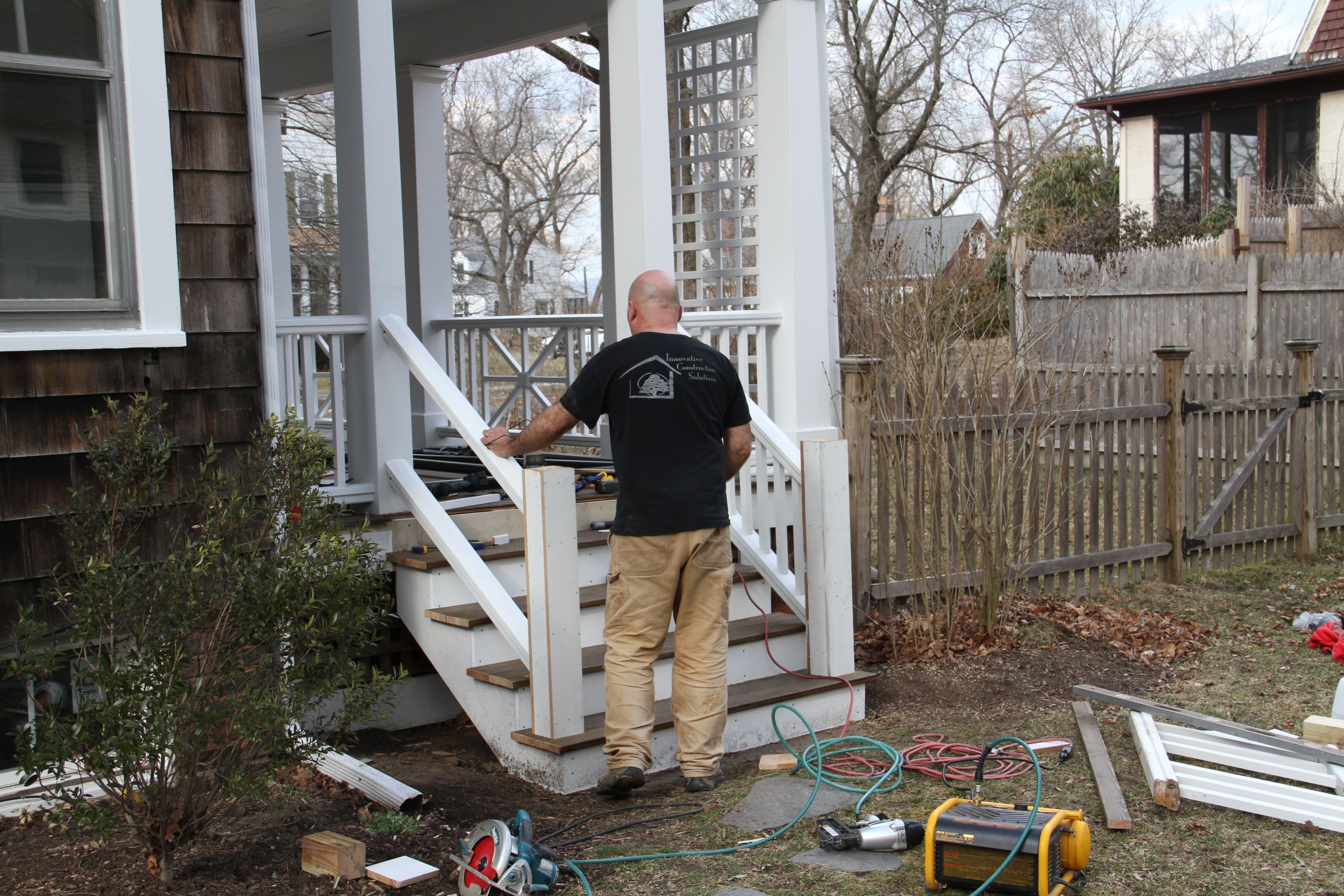 DURING: Pappy working on the railings for the main porch. The look here is one of restoration, and I believe they nailed it. (Puns are free around here.)
