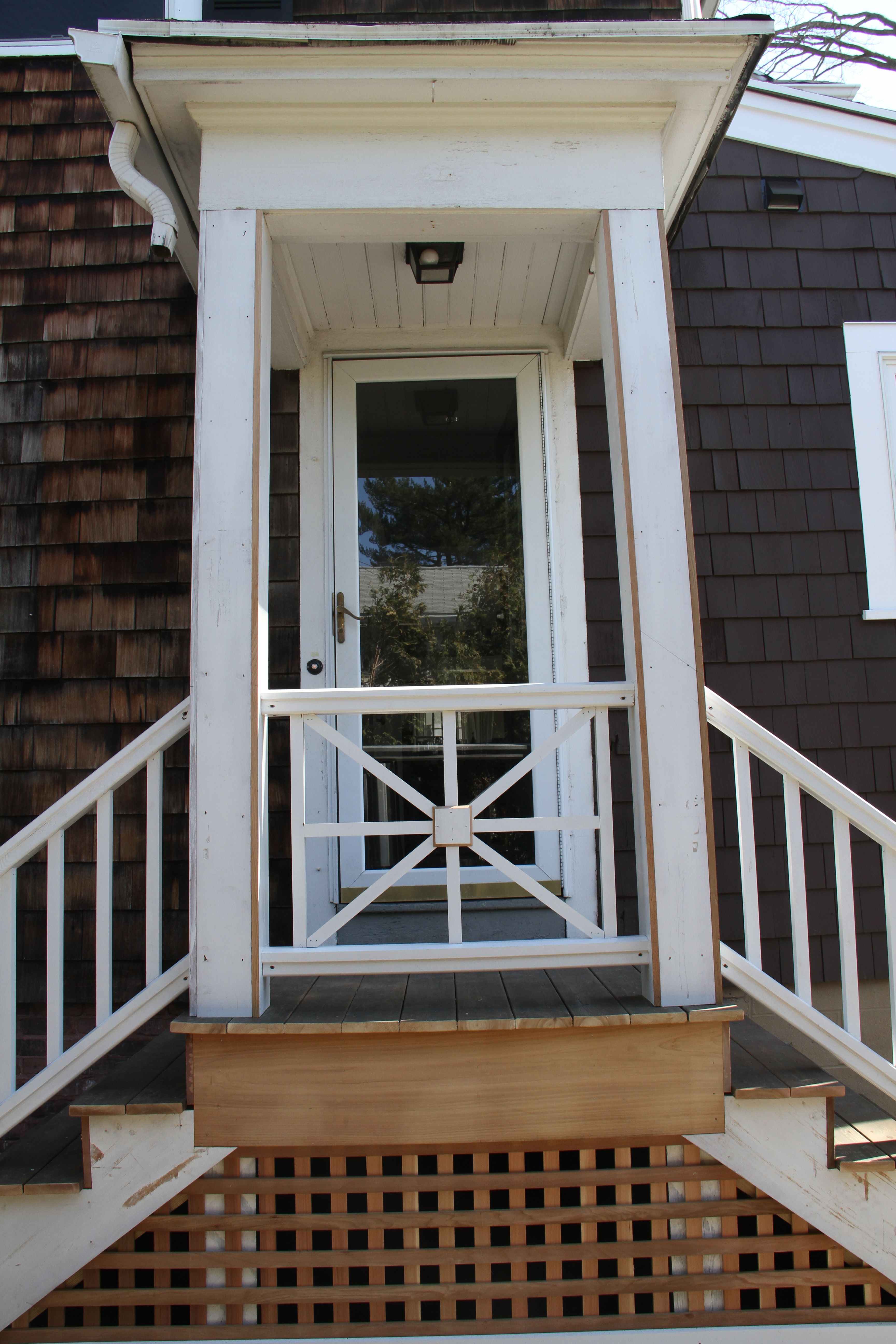 AFTER: We still have the business of a new storm door to install (the one pictured above didn't really survive the remodel and is terribly hard to open and close), but the overall look of the entry gives instant curb appeal.
