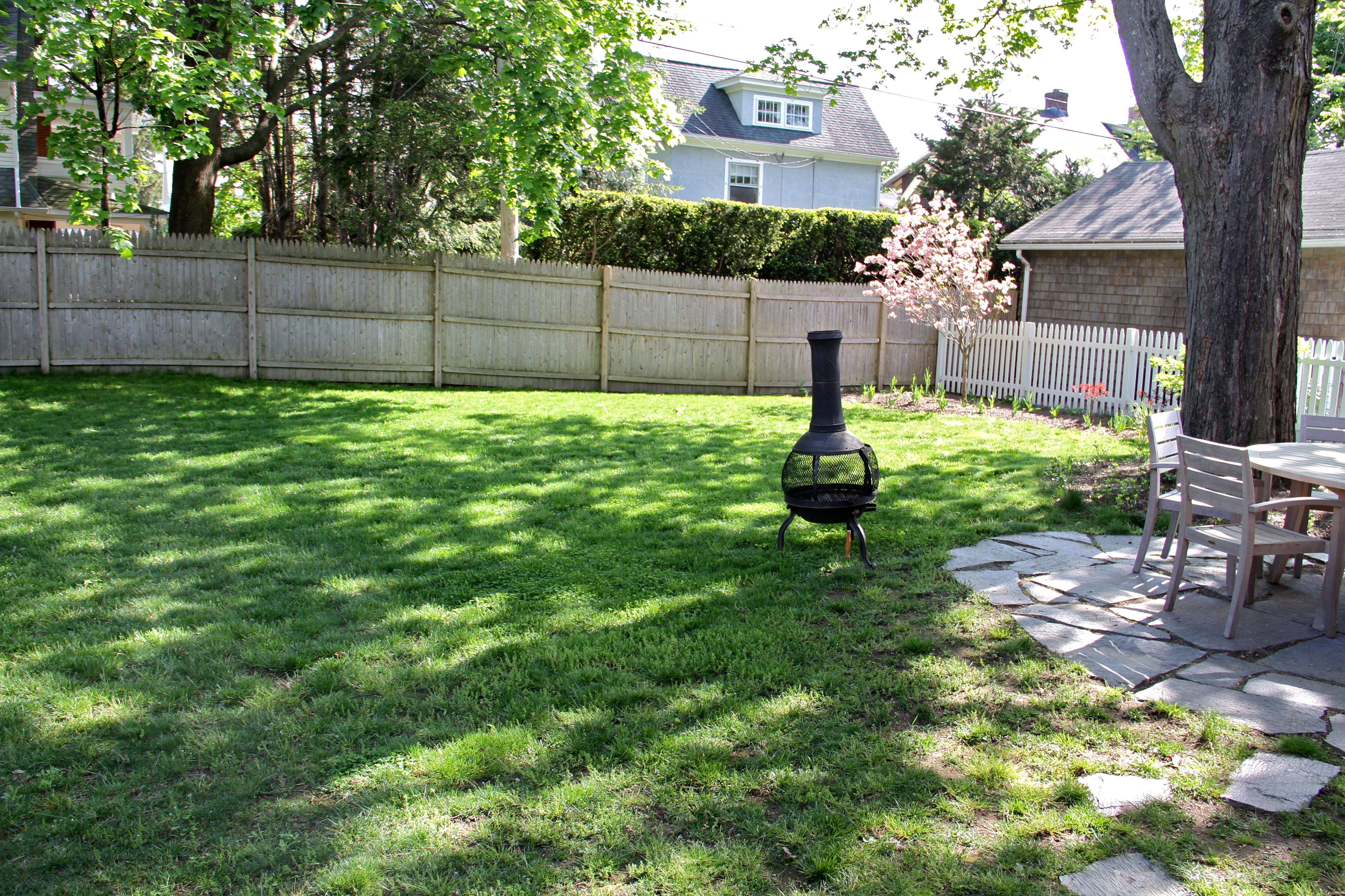 This is how the yard is looking these days - fence stained, compost contained, clean and pretty.