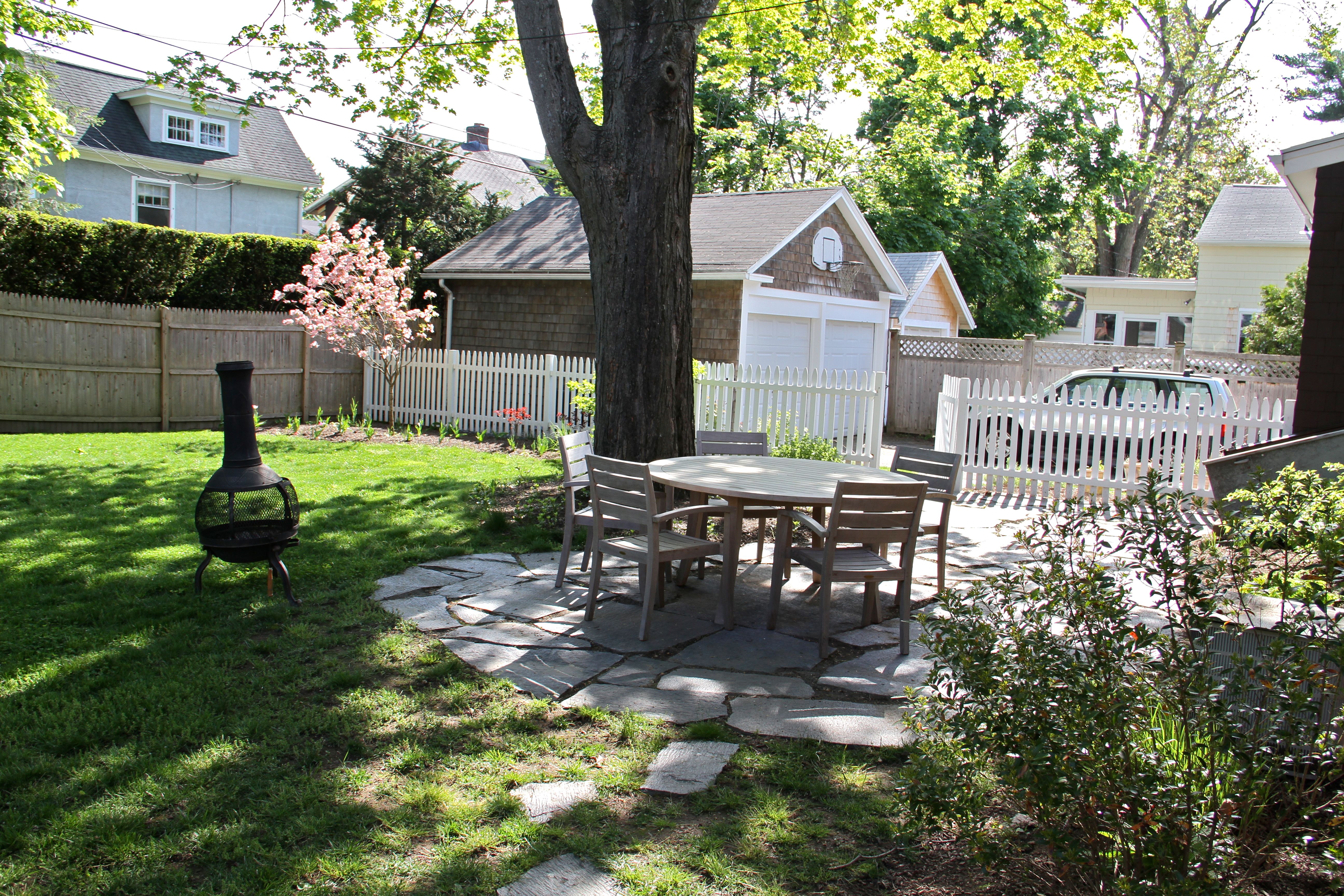 AFTER: The yard is getting there, and so are the trees. Soon it'll be time for BBQ's, fizzy bubbly drinks in the summer air, and warm breezes that lift your spirits and carry your troubles away. Ahhhh.